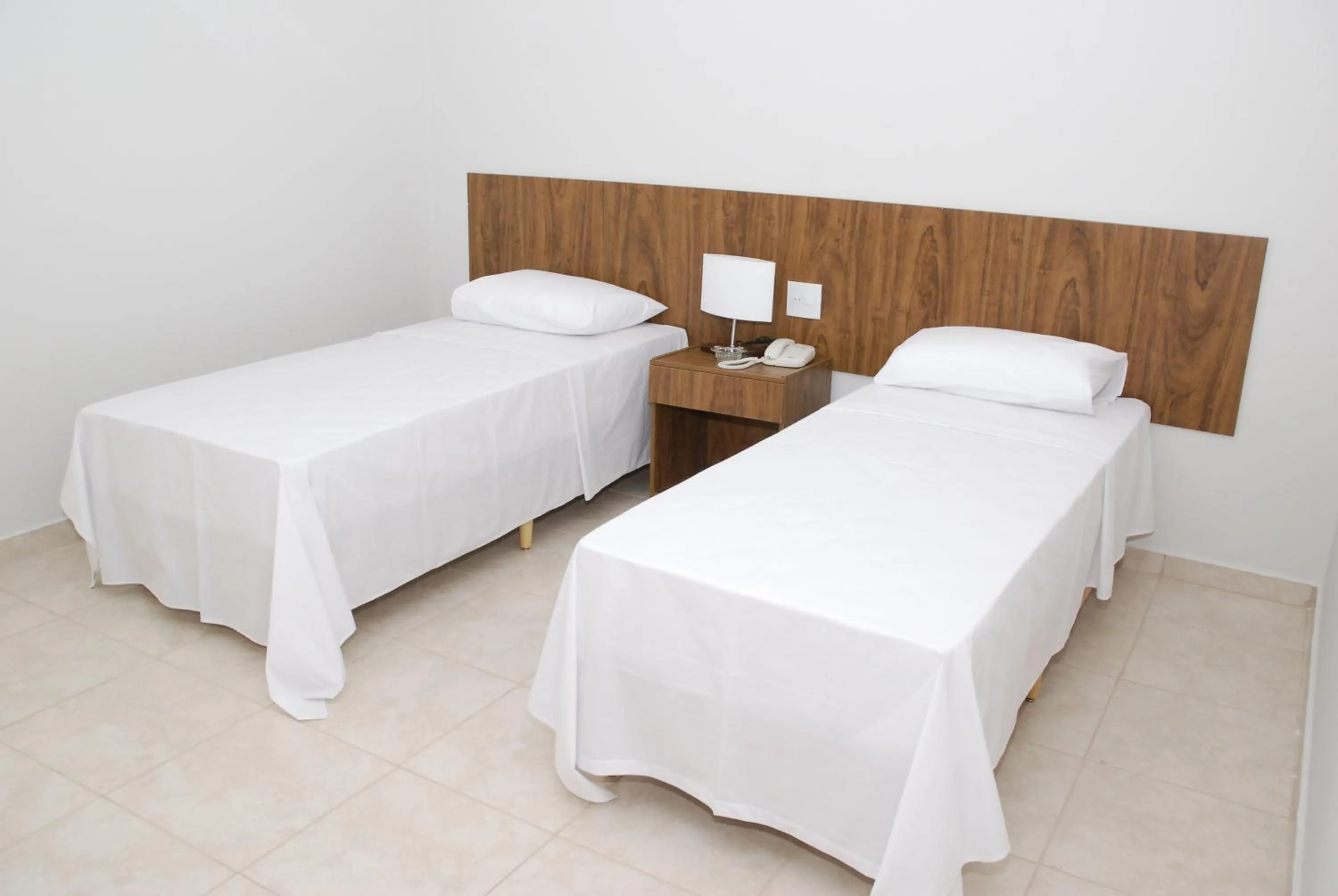 Bed in Monte Castro Executive Hotel