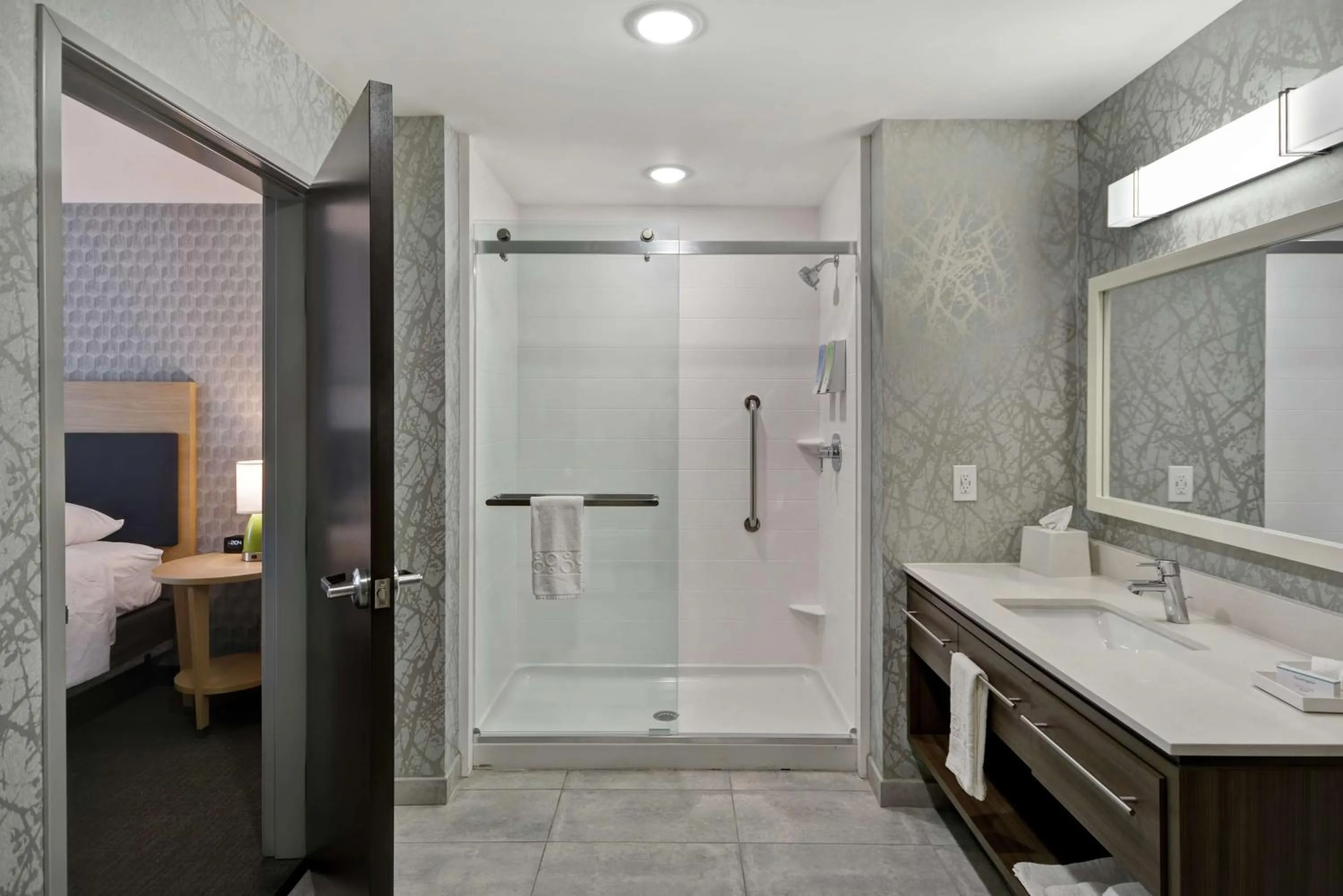 Bathroom, Bed in Home2 Suites By Hilton Grand Rapids North