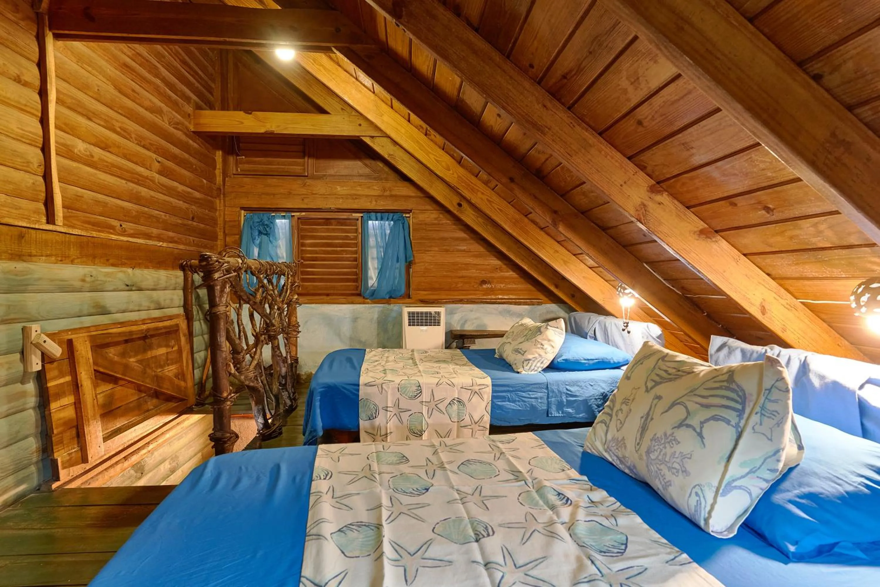 Bed in CHALET TROPICAL Hotel & Pool Bar Restaurant