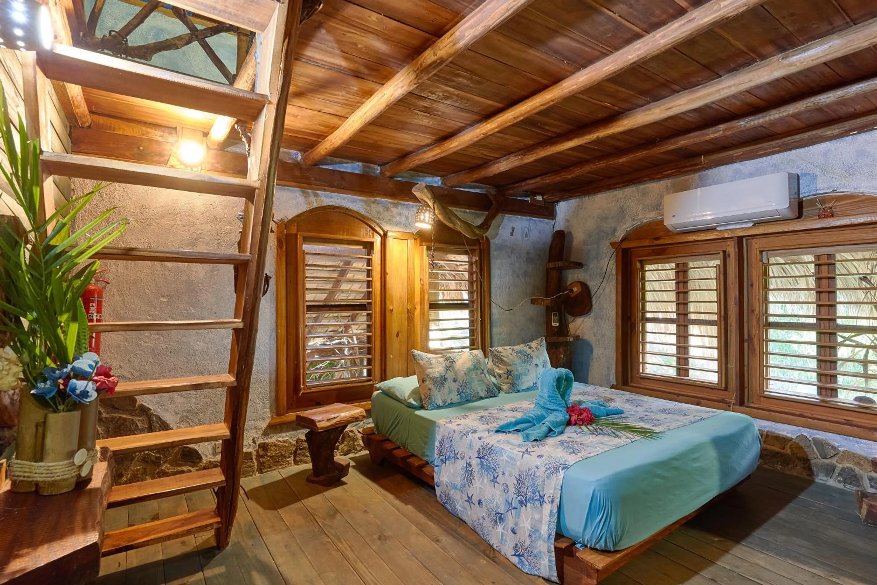 Bedroom, Bed in CHALET TROPICAL Hotel & Pool Bar Restaurant