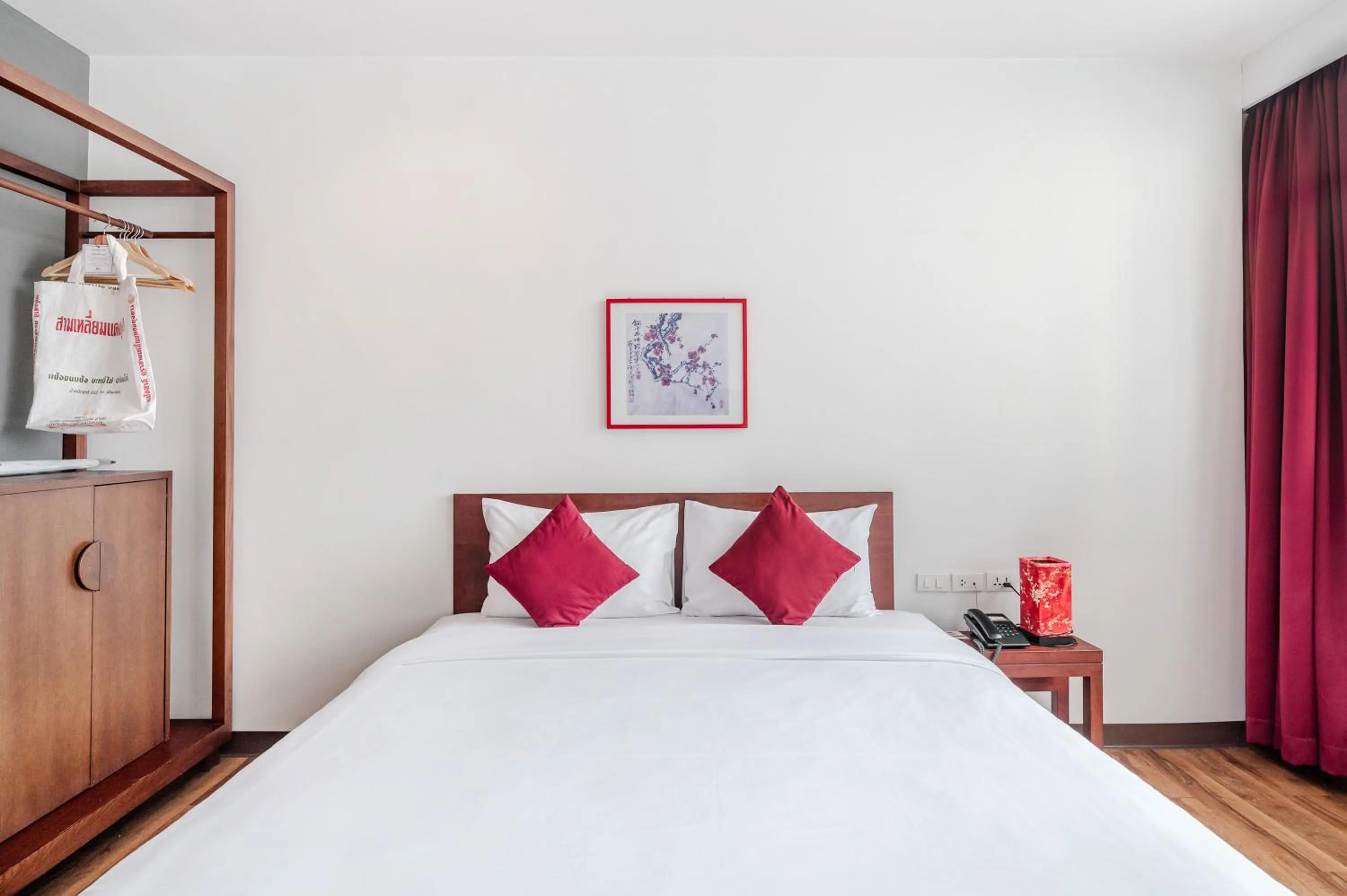 Bed in Ruamchitt Plaza Hotel