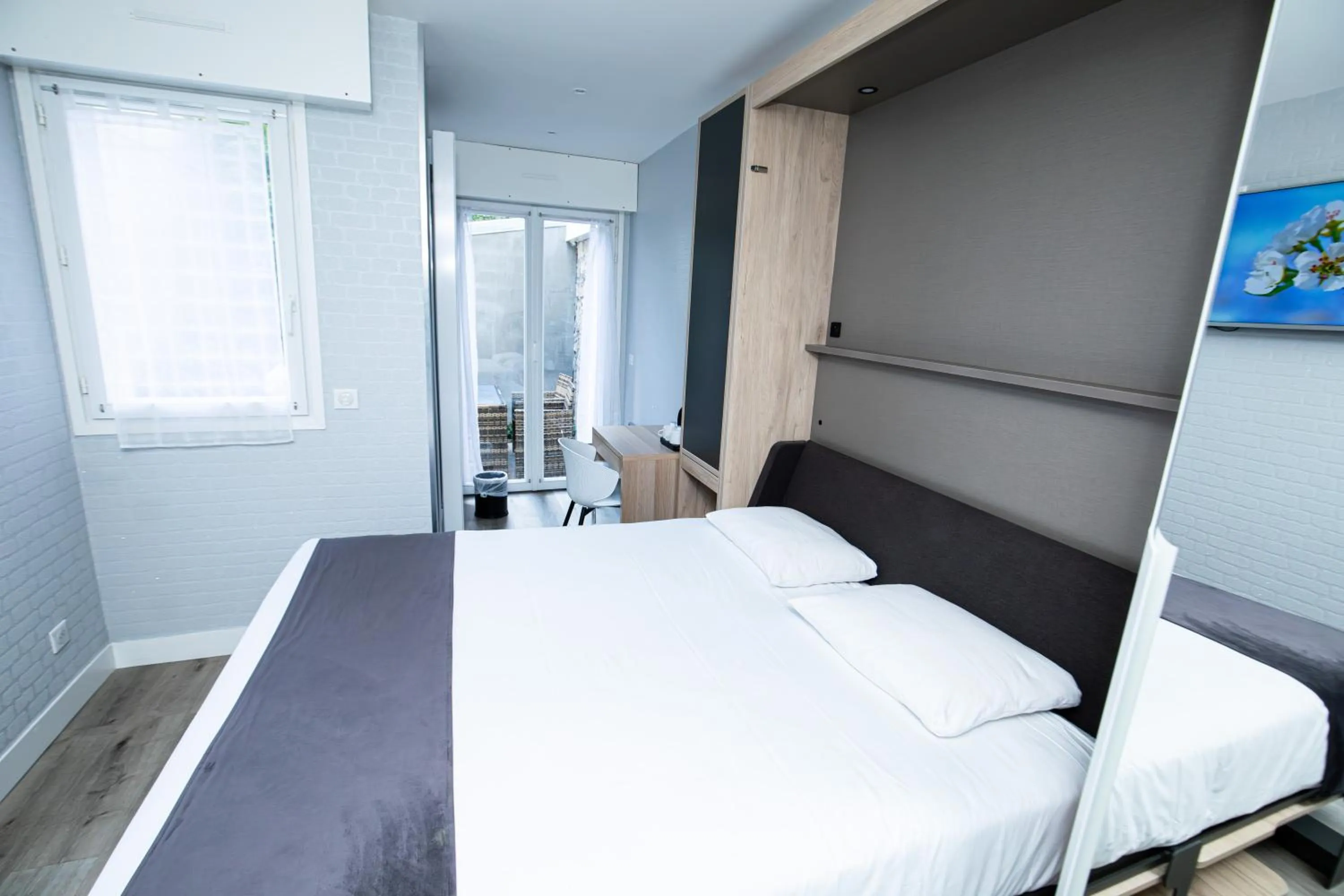 Photo of the whole room, Bed in HOTEL DE PARIS MONTPARNASSE