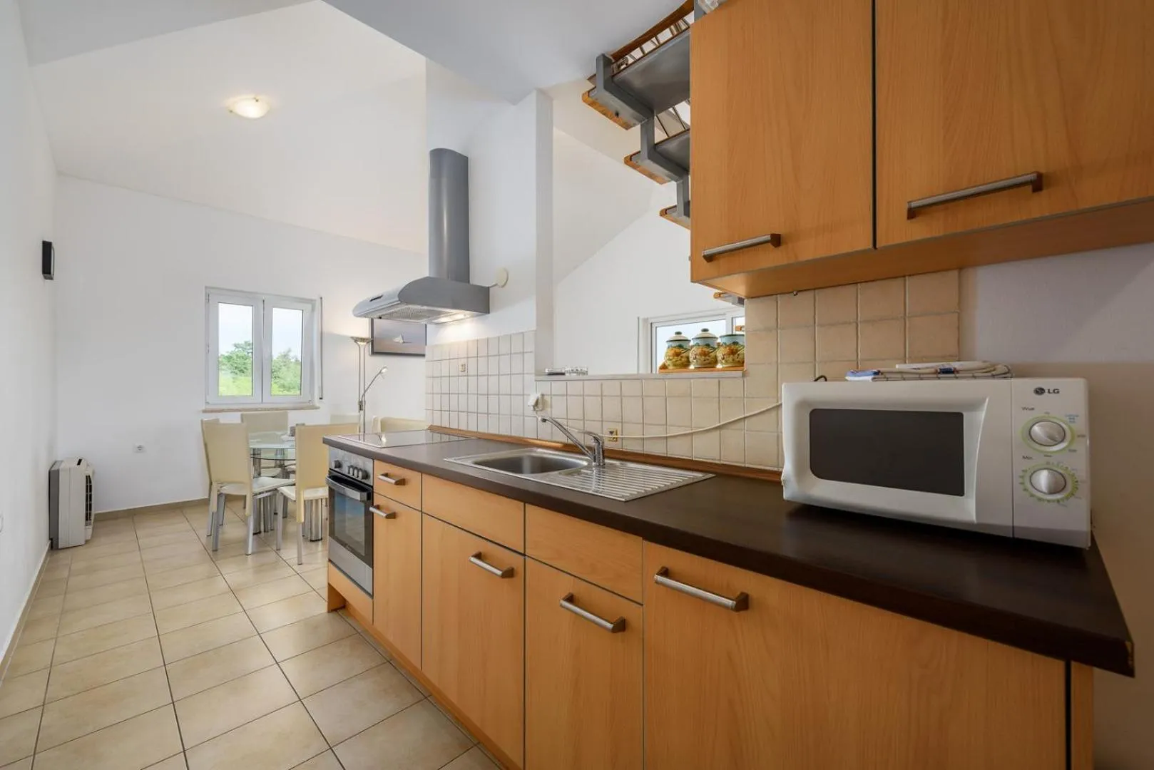 Kitchen or kitchenette in Adria Apartments