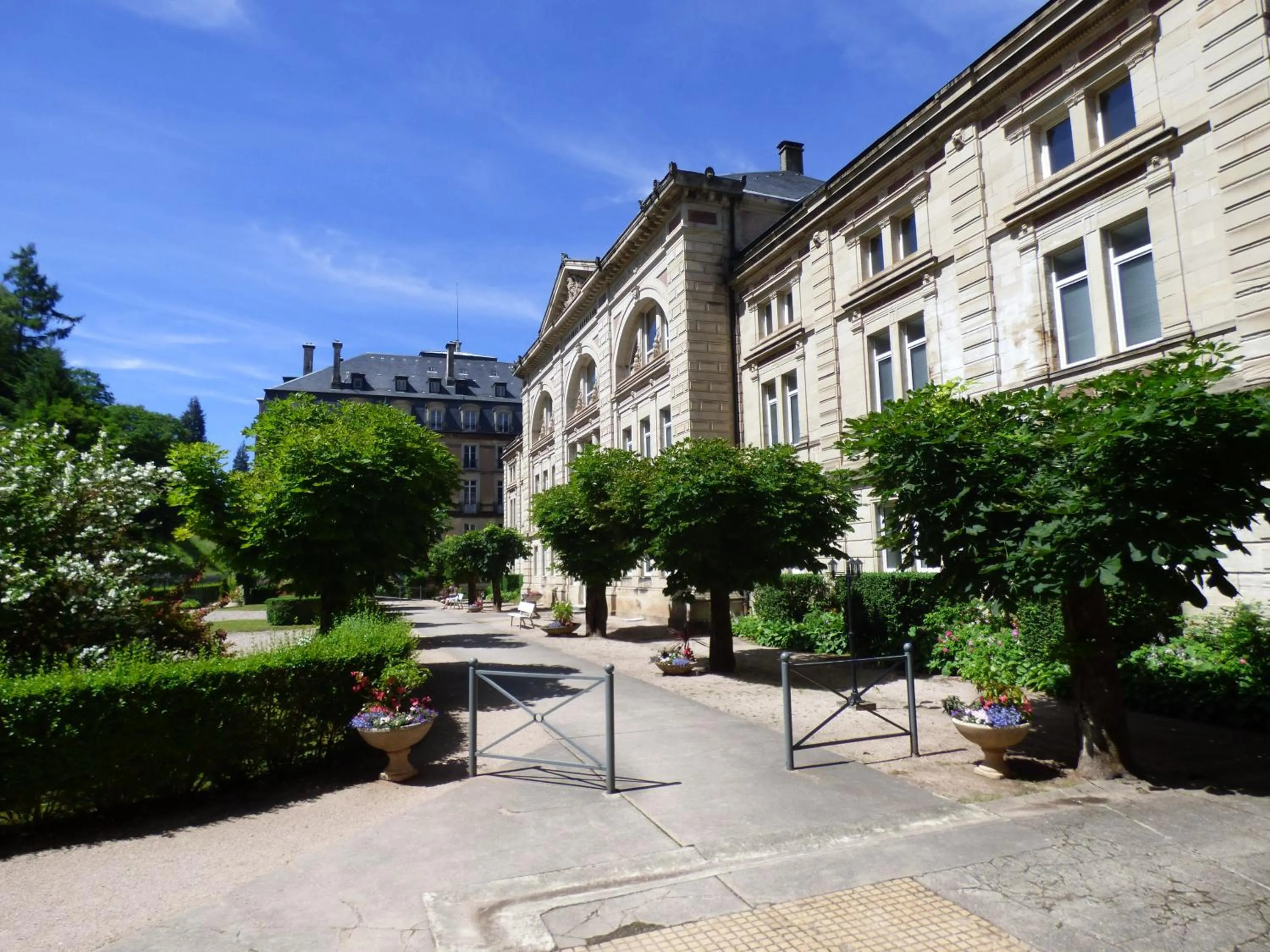 Facade/entrance in Le Grand Hotel de Plombières by Popinns