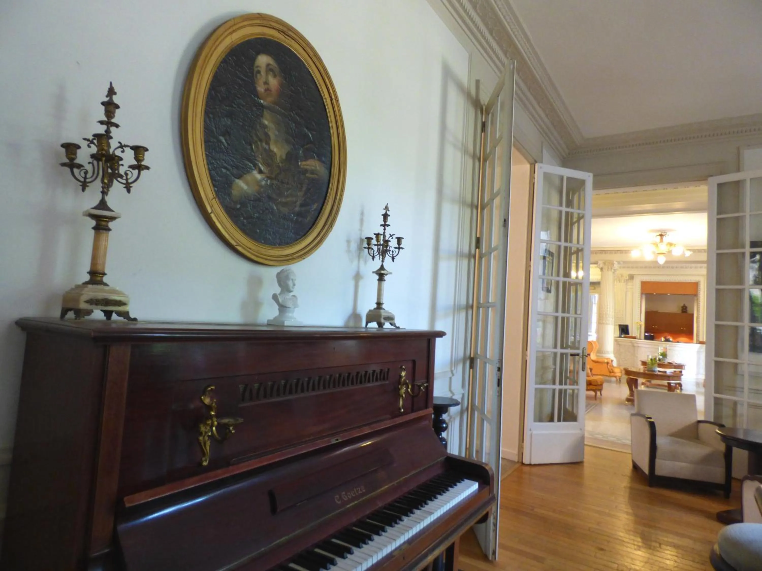 Communal lounge/ TV room in Le Grand Hotel de Plombières by Popinns