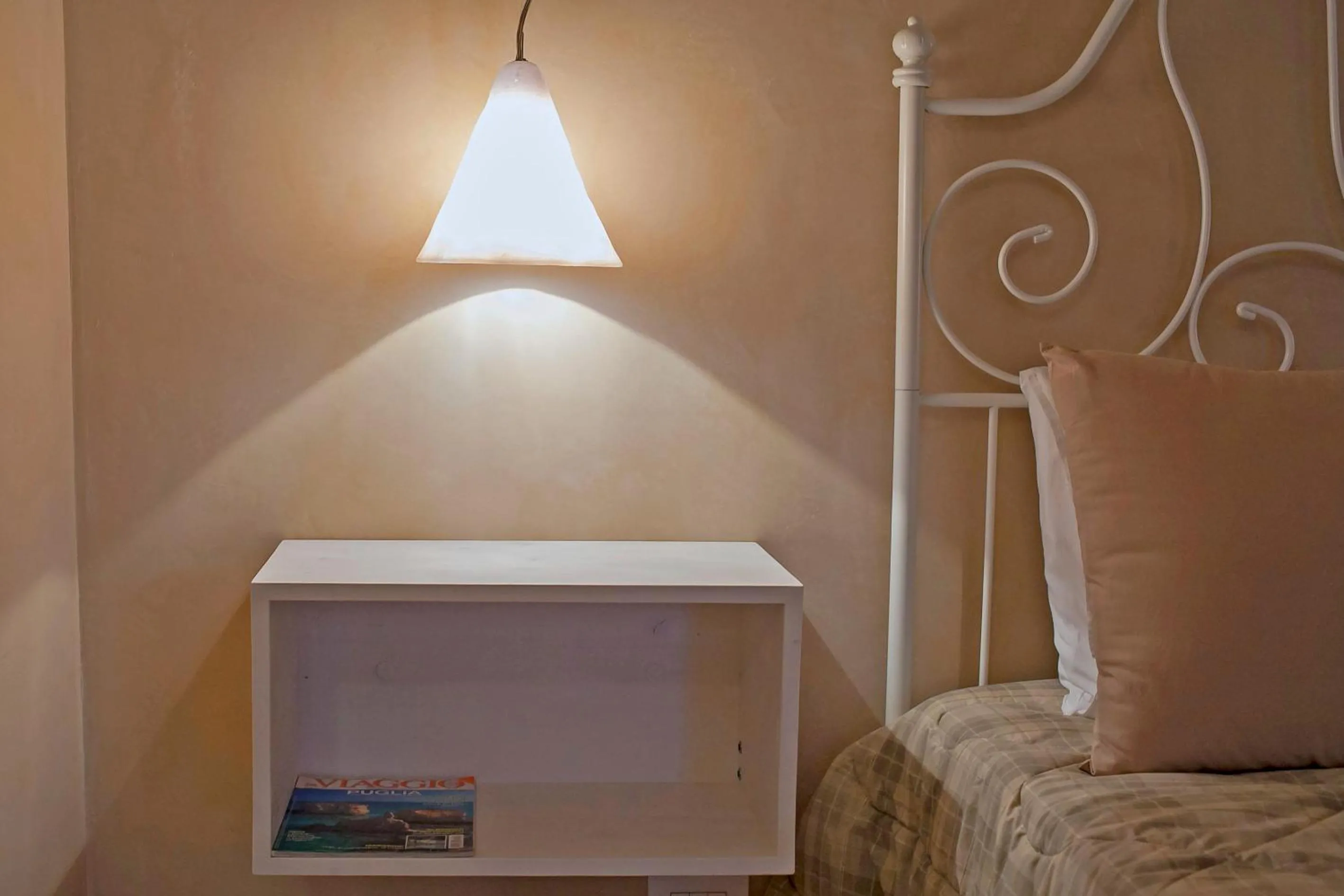 Decorative detail, Bed in Il Calàscione Apulian Villas