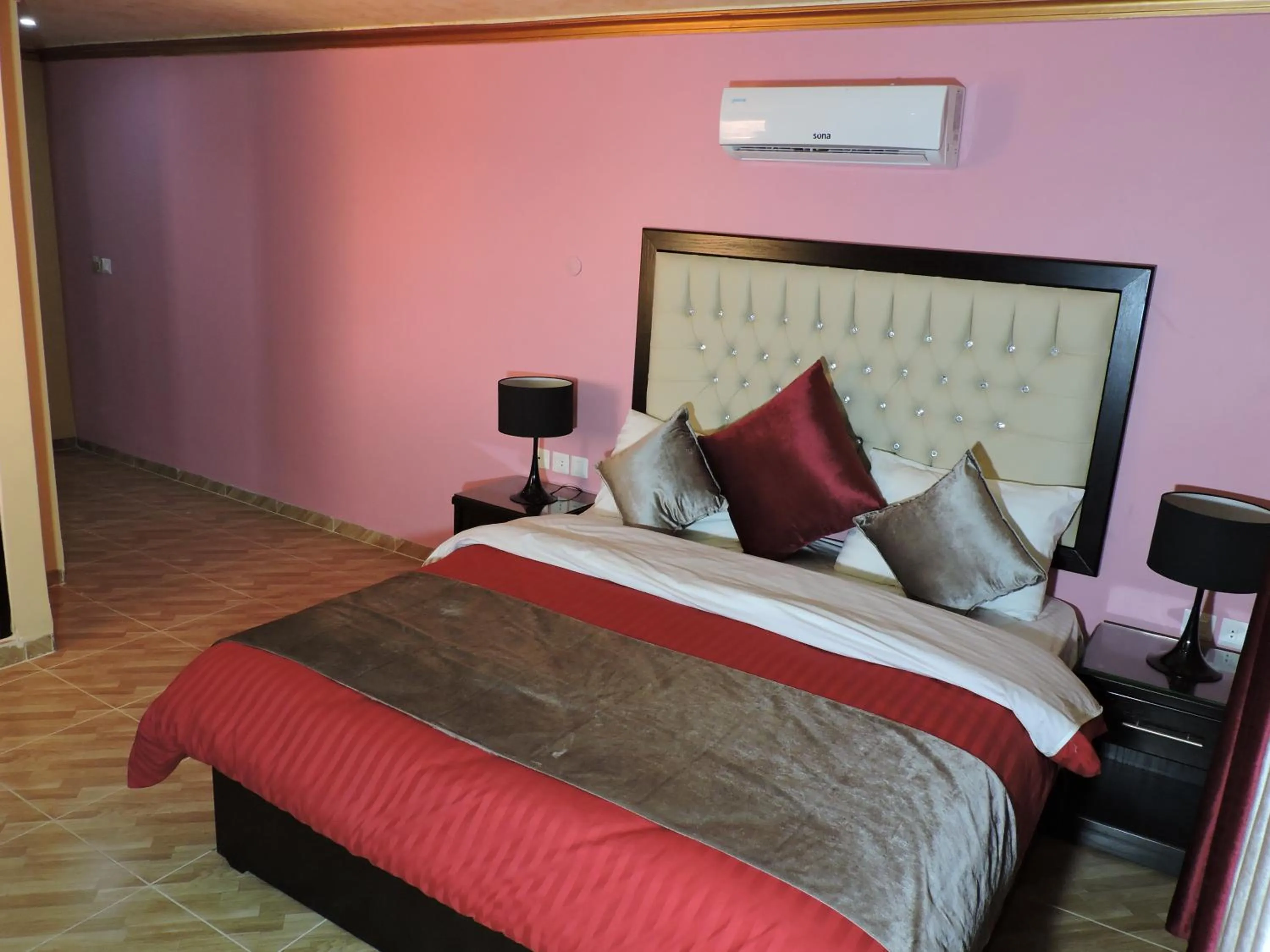 Bed in Valentine Inn Luxury