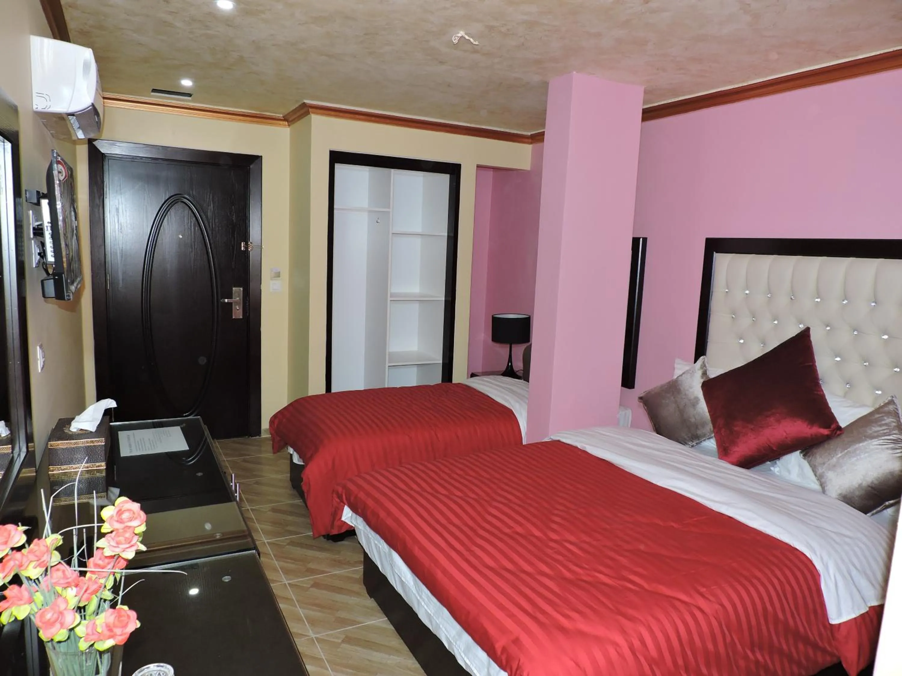 Bed in Valentine Inn Luxury