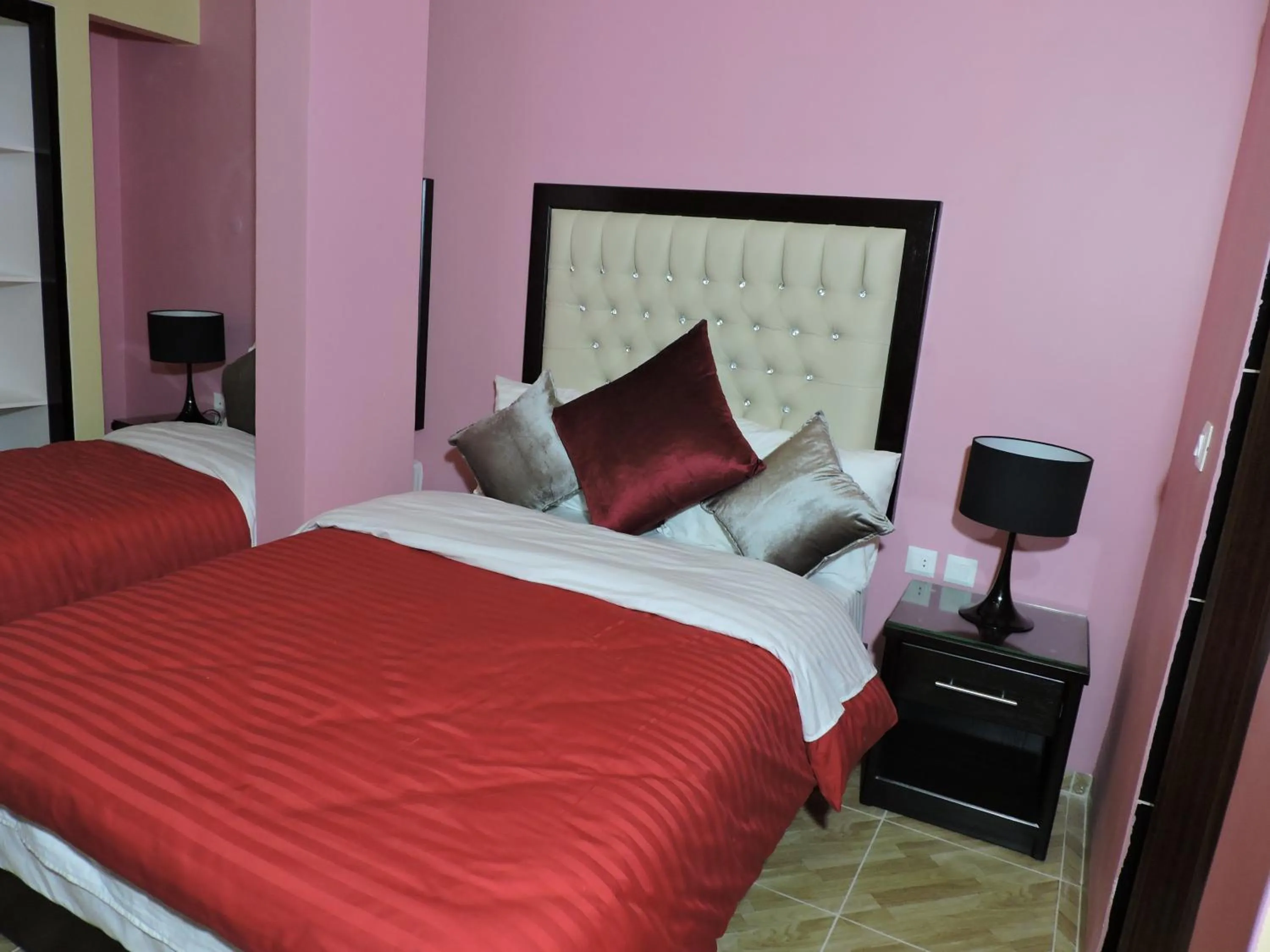 Bed in Valentine Inn Luxury