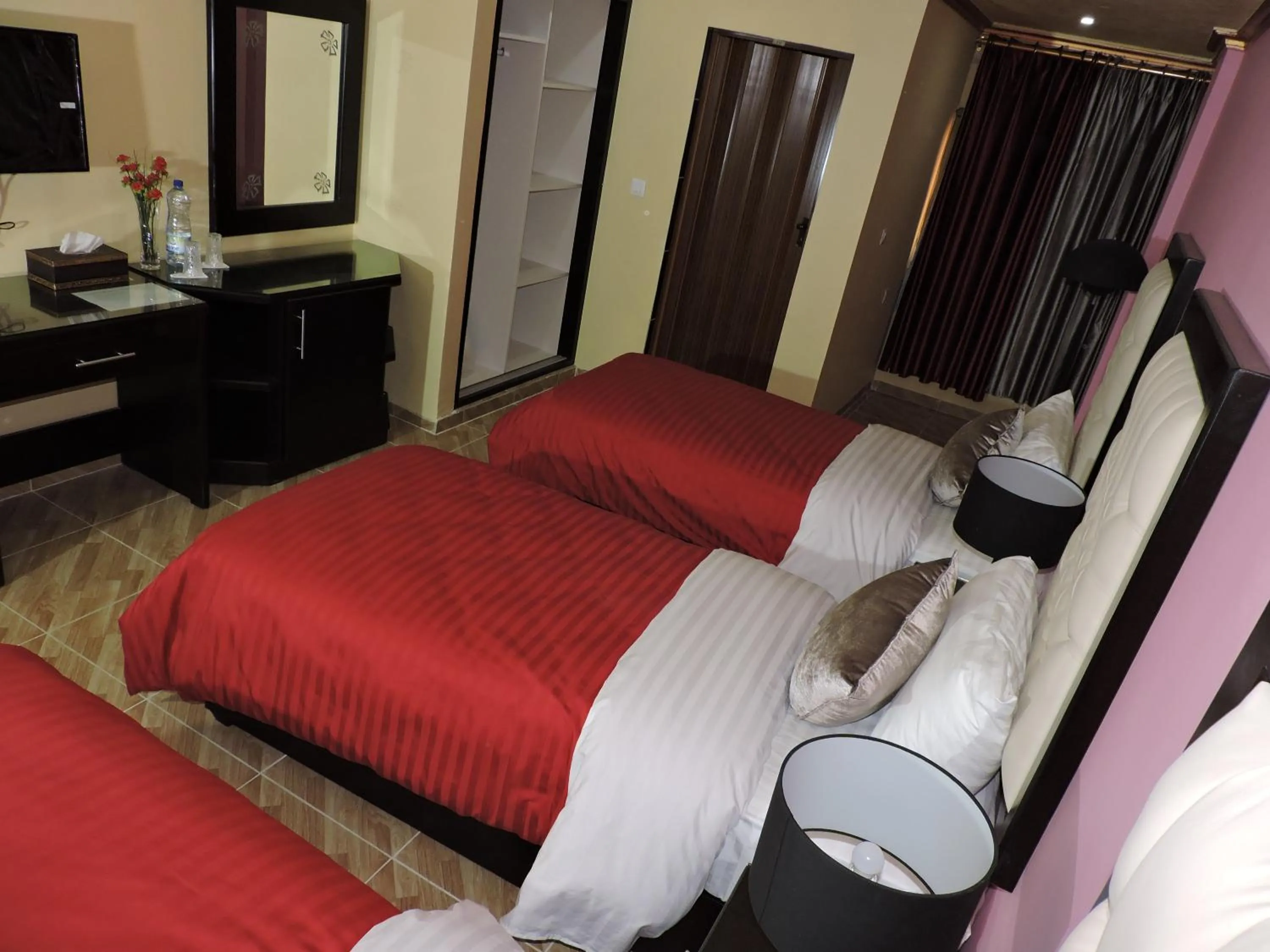 Bed in Valentine Inn Luxury