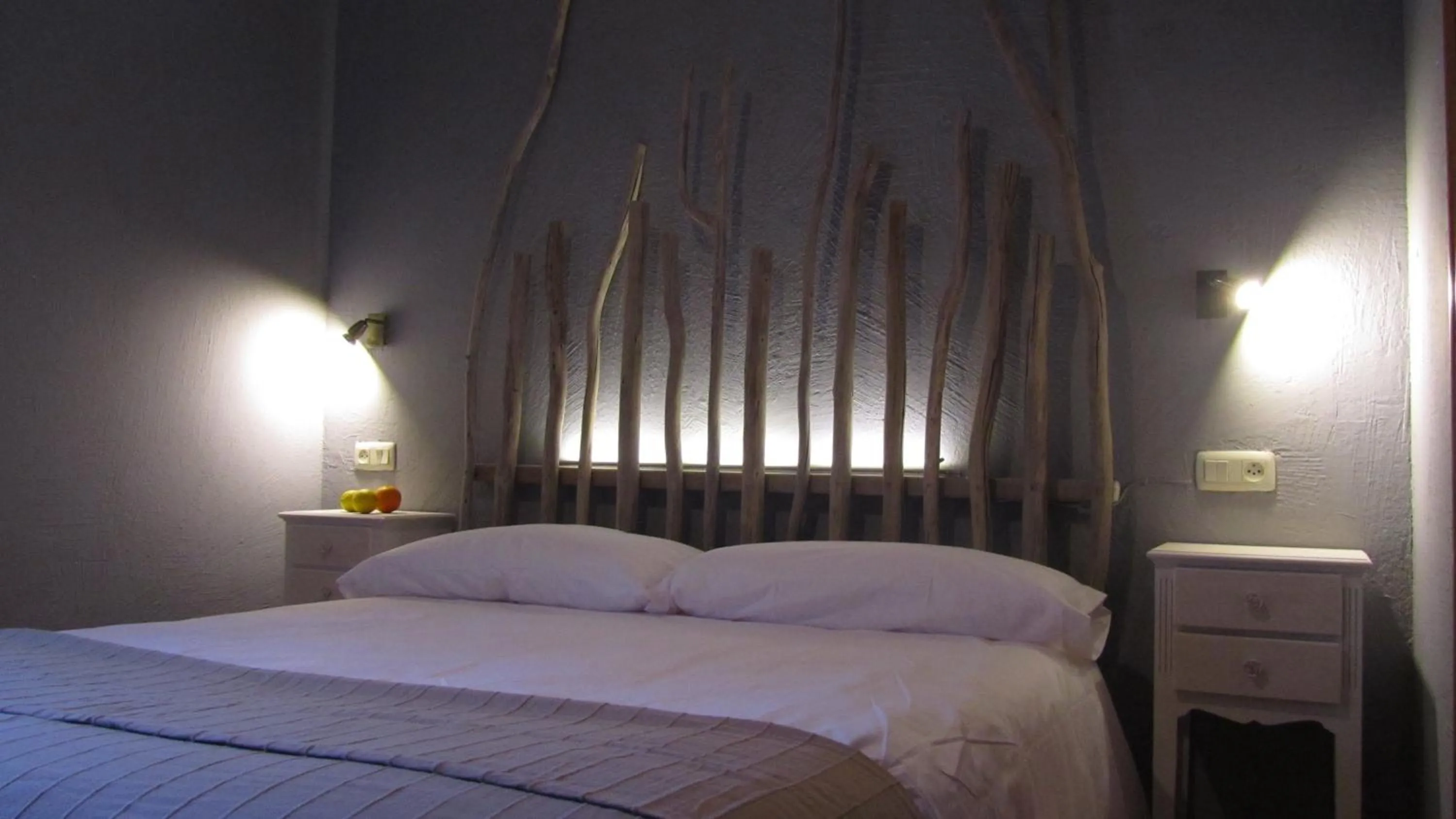 Bed in Posada Rural Bistruey