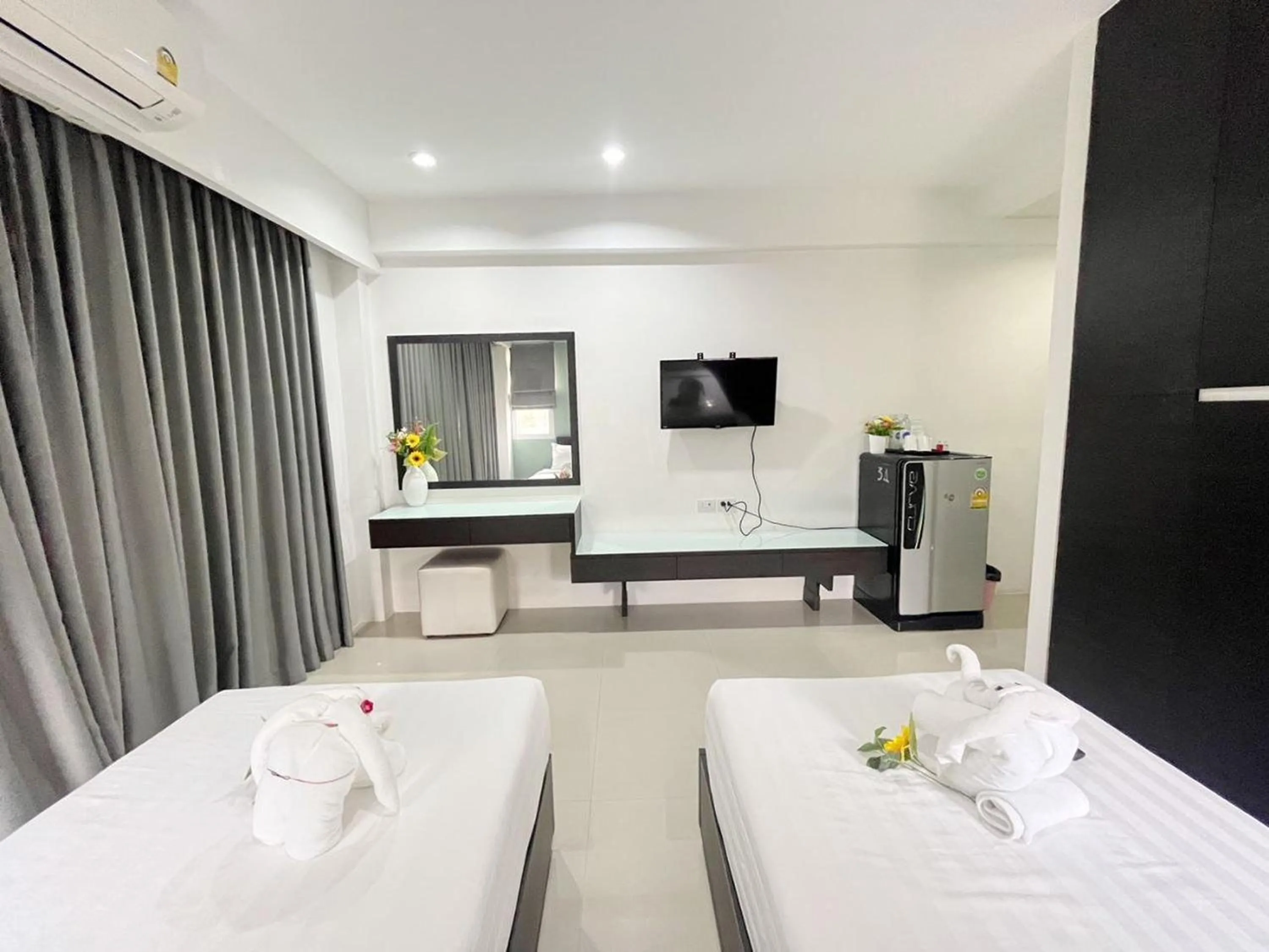 Bed in Ruan Plaisoi Apartment