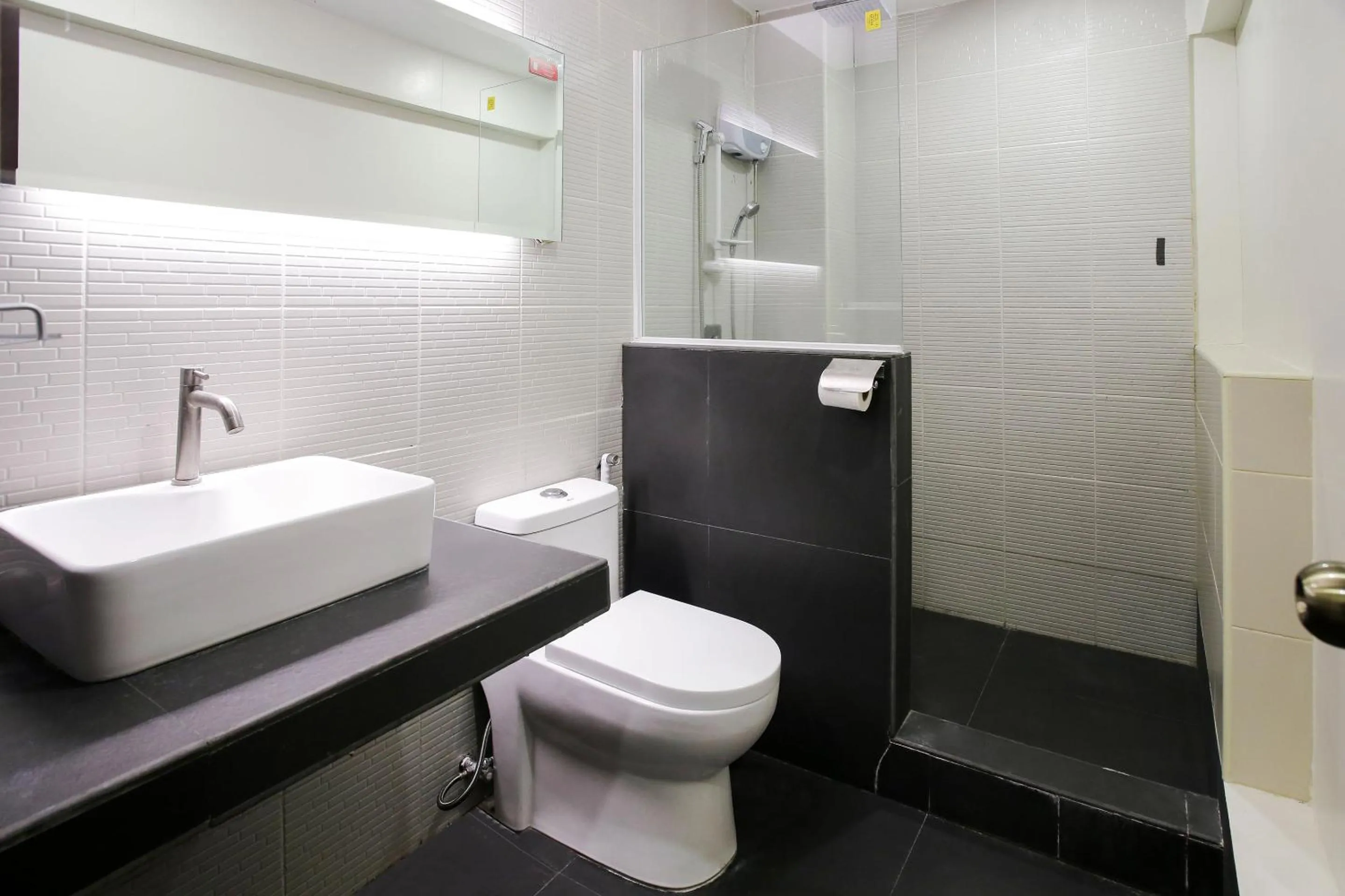 Bathroom in Capital O 786 KWE Hotel and Resort.