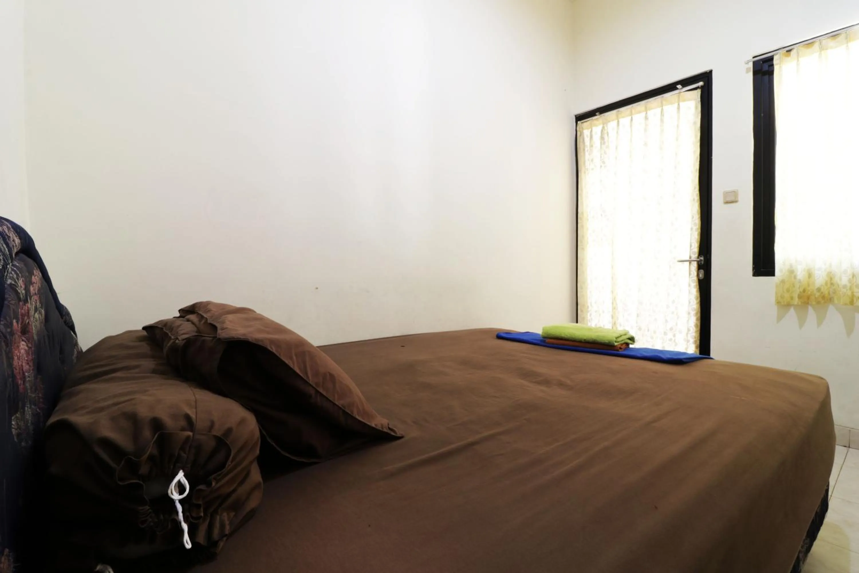 Bed in Penginapan Marsya Prima Syariah