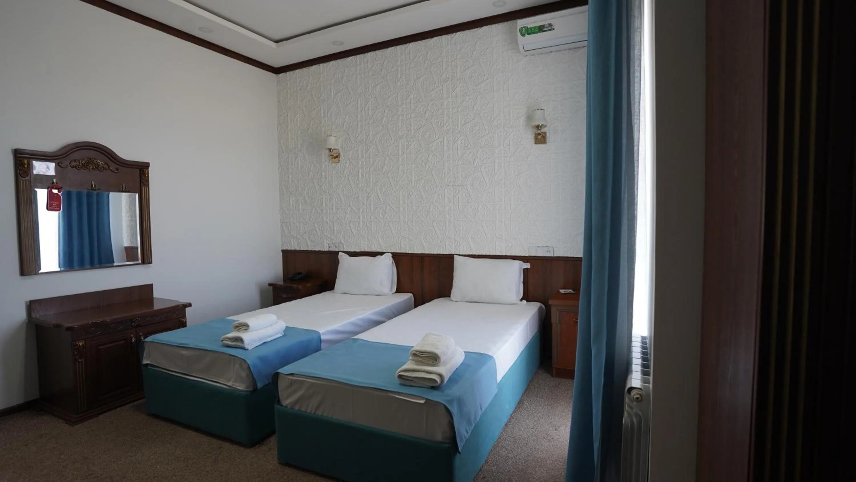 Bed in Hotel Khiva Palace