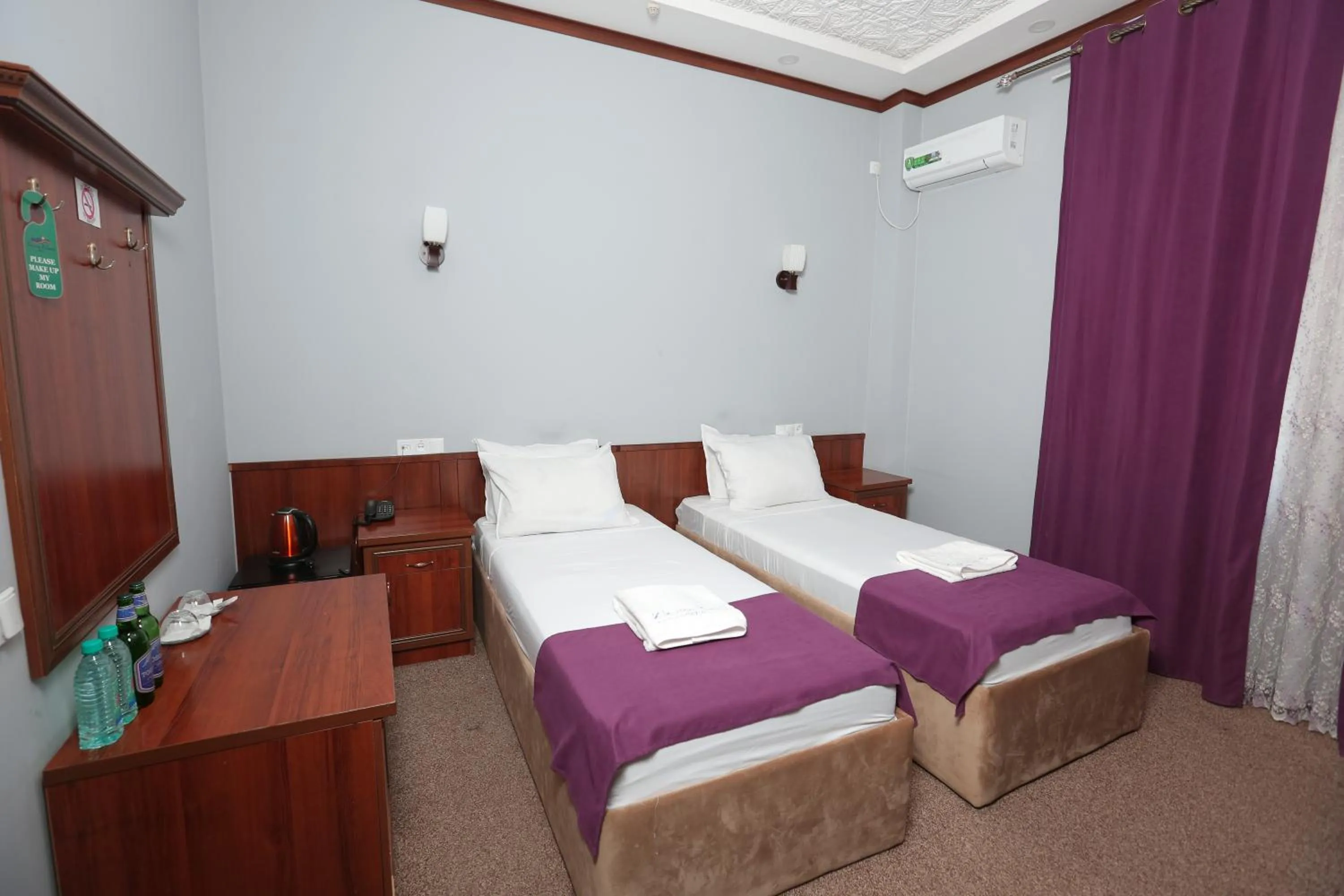 Bed in Hotel Khiva Palace