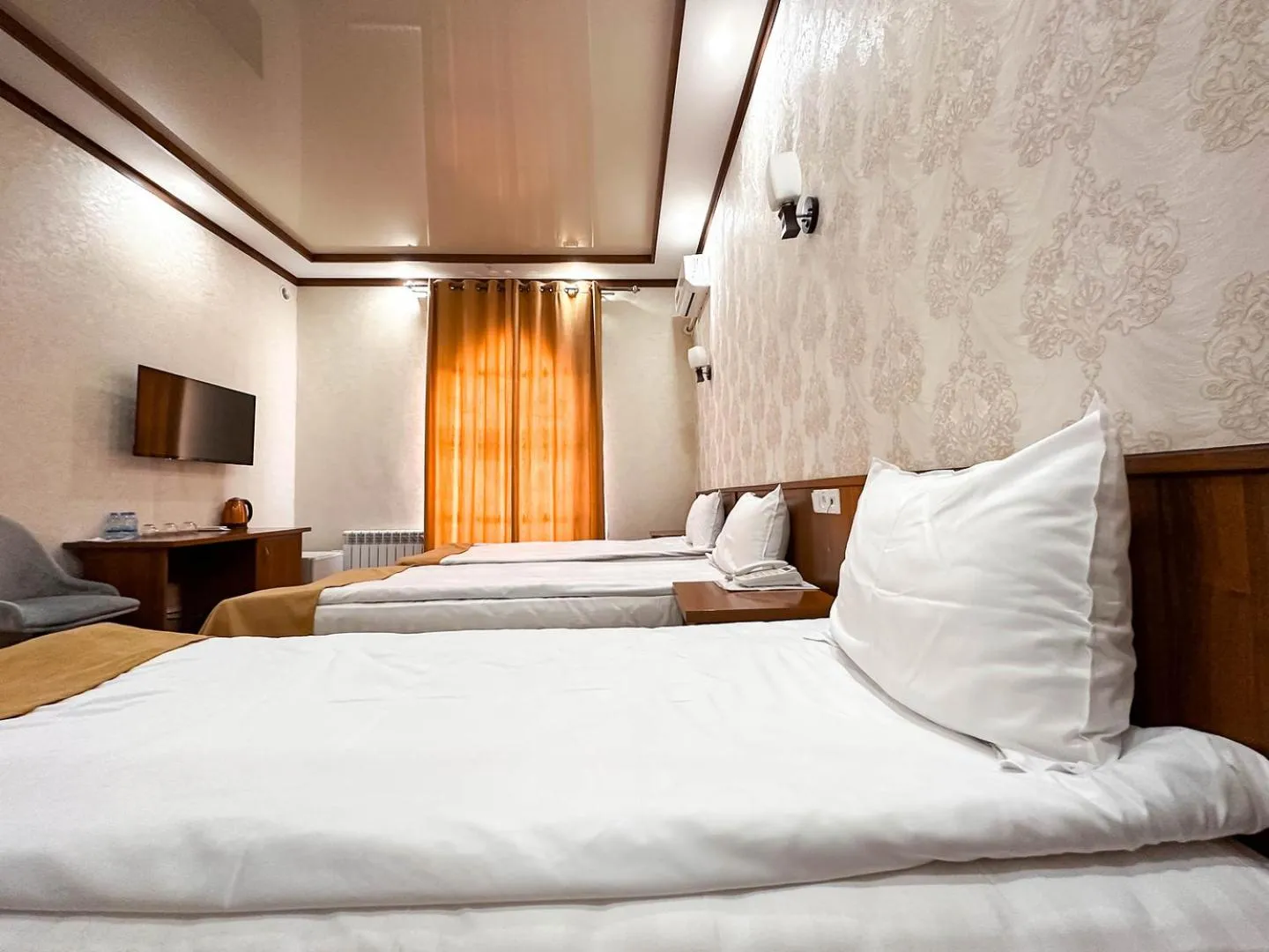 Bed in Hotel Khiva Palace