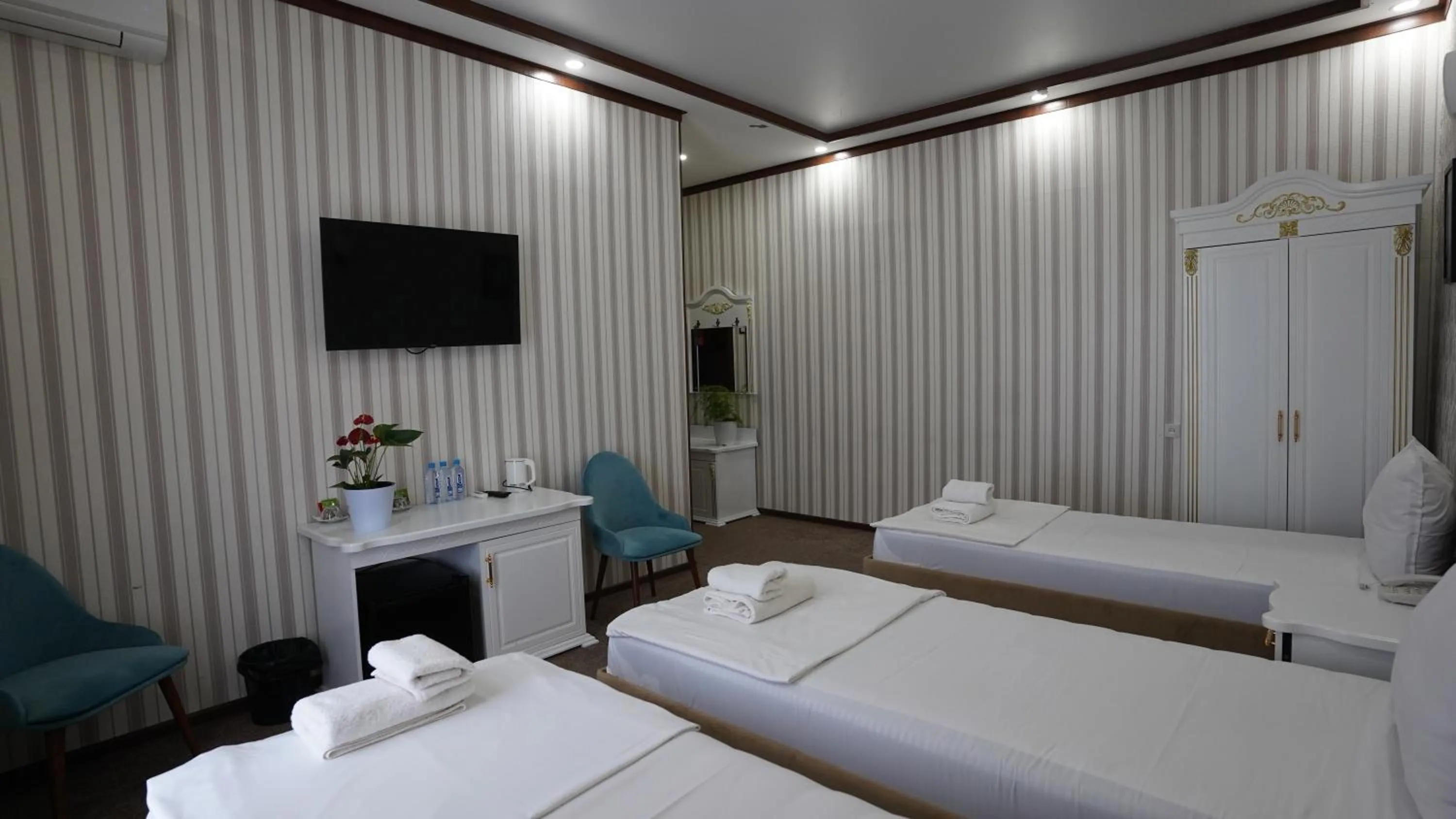 Bed in Hotel Khiva Palace