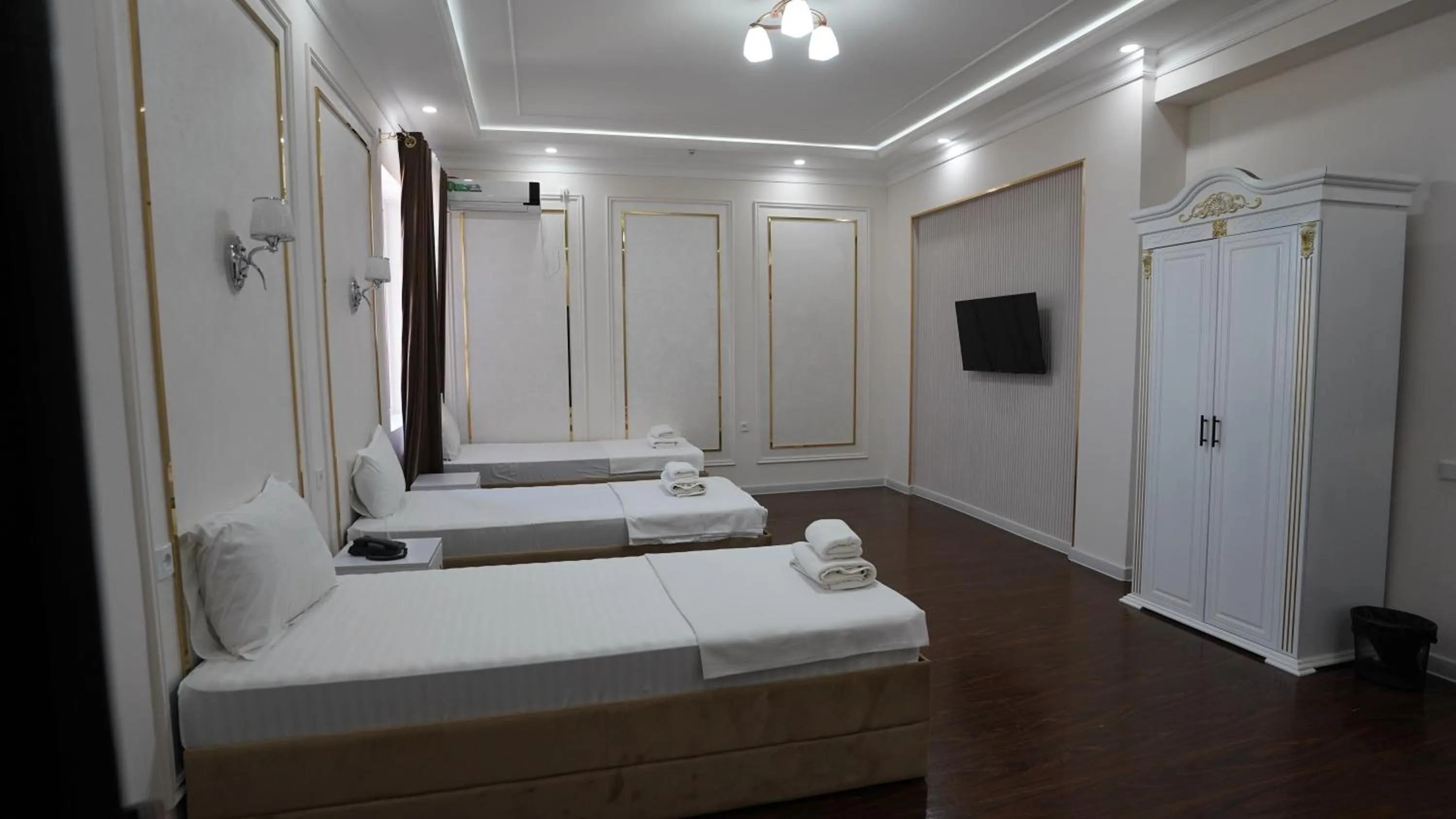 Bed in Hotel Khiva Palace