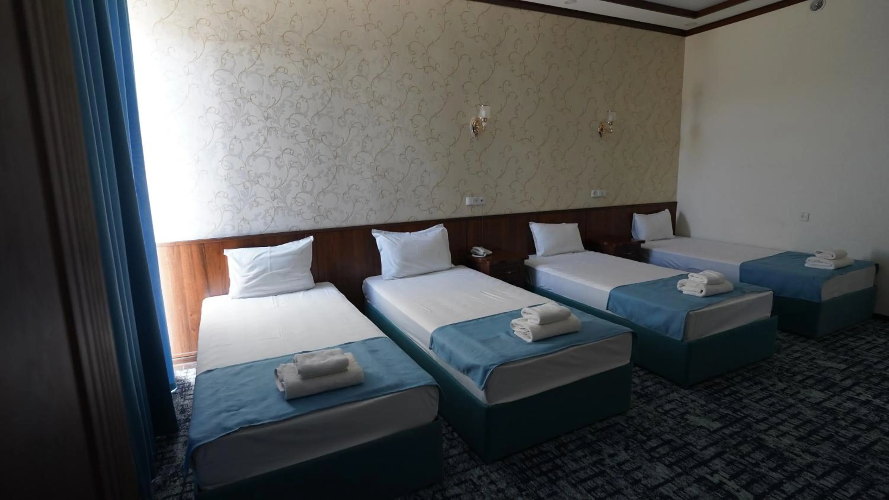 Bed in Hotel Khiva Palace