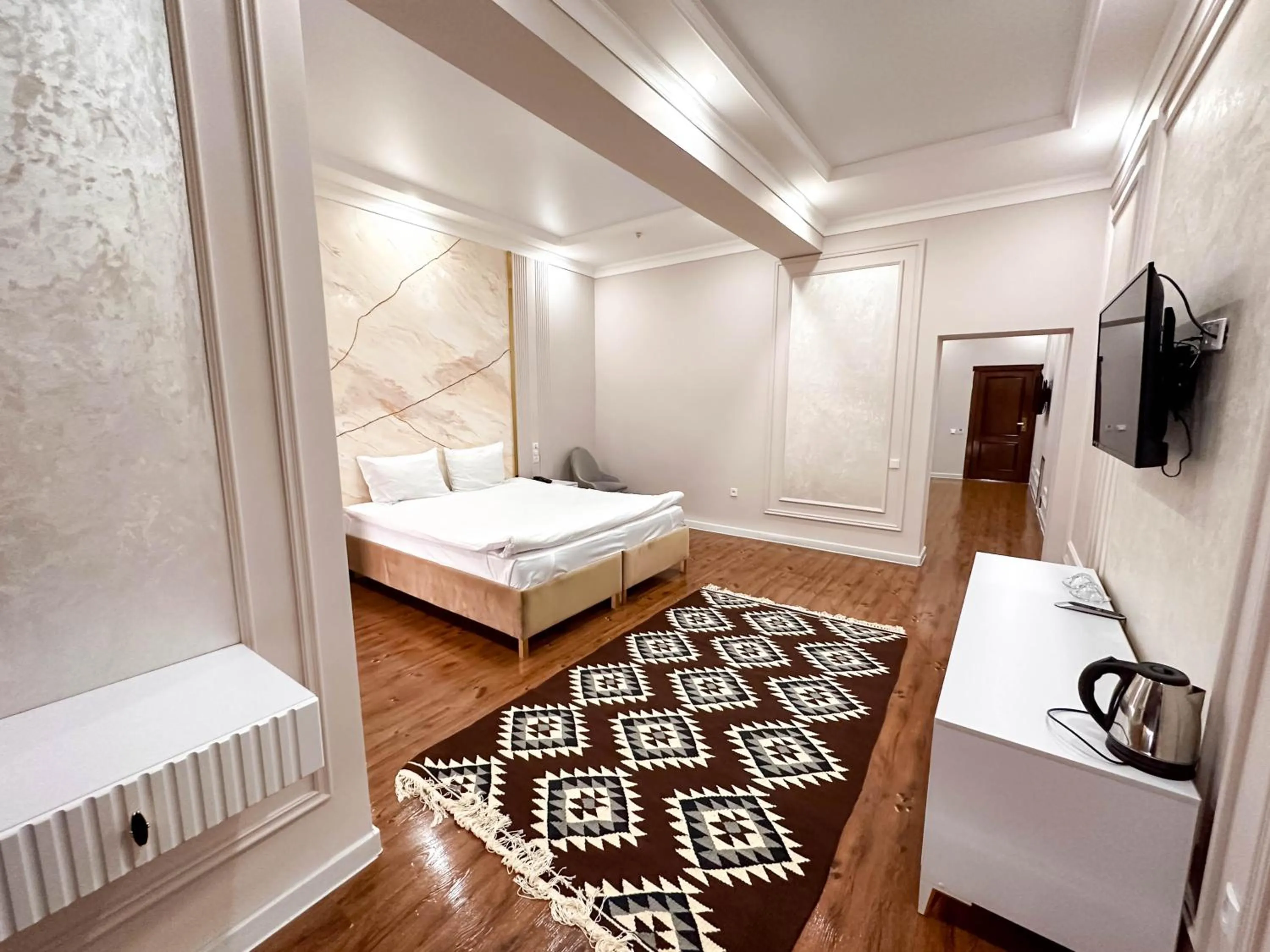 Bed in Hotel Khiva Palace