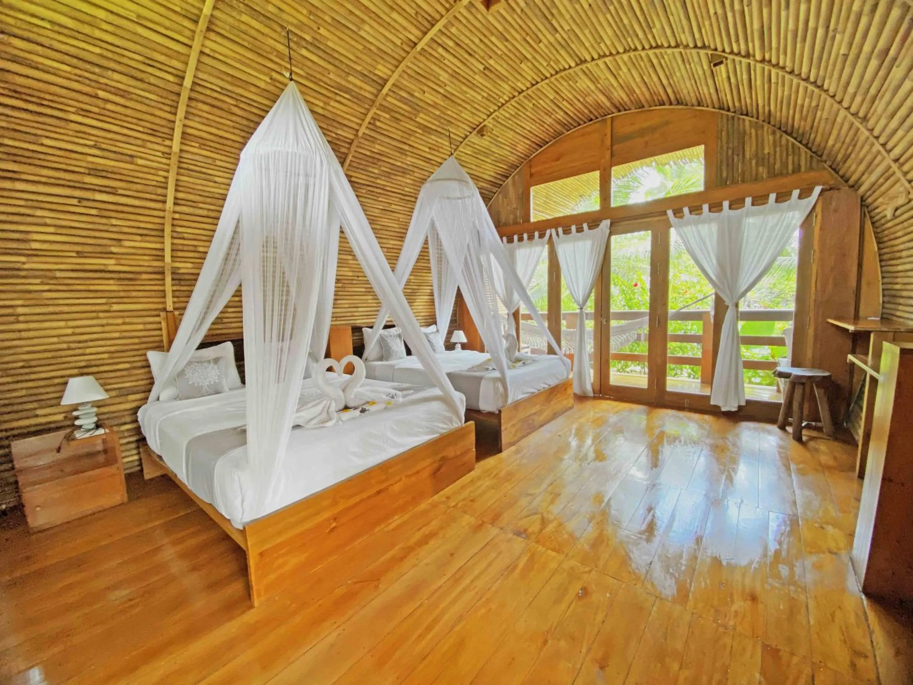 Bed in Lagoona Beach Bungalows - Eco Bungalows Batukaras