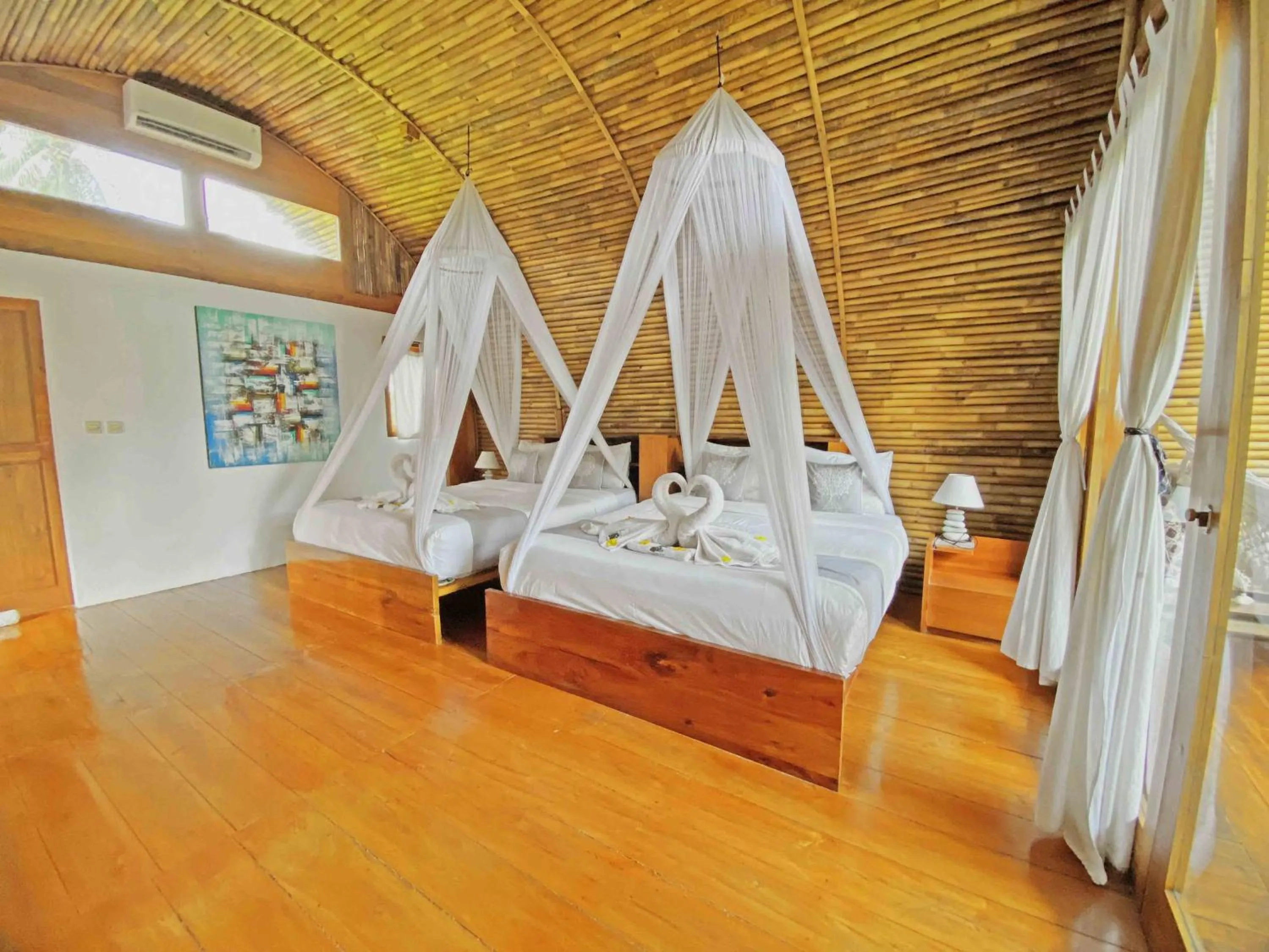 Photo of the whole room, Bed in Lagoona Beach Bungalows - Eco Bungalows Batukaras