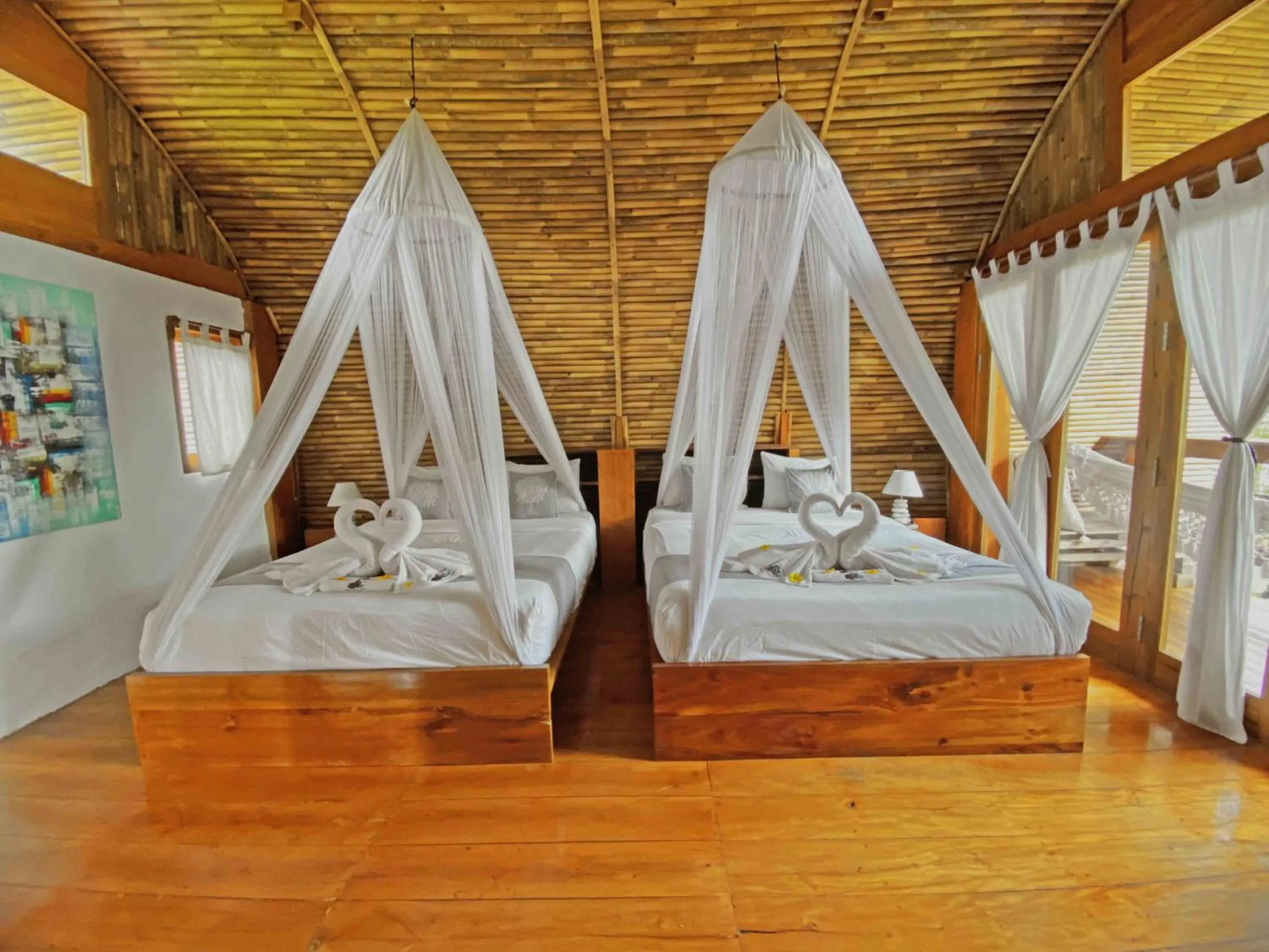 Photo of the whole room, Bed in Lagoona Beach Bungalows - Eco Bungalows Batukaras