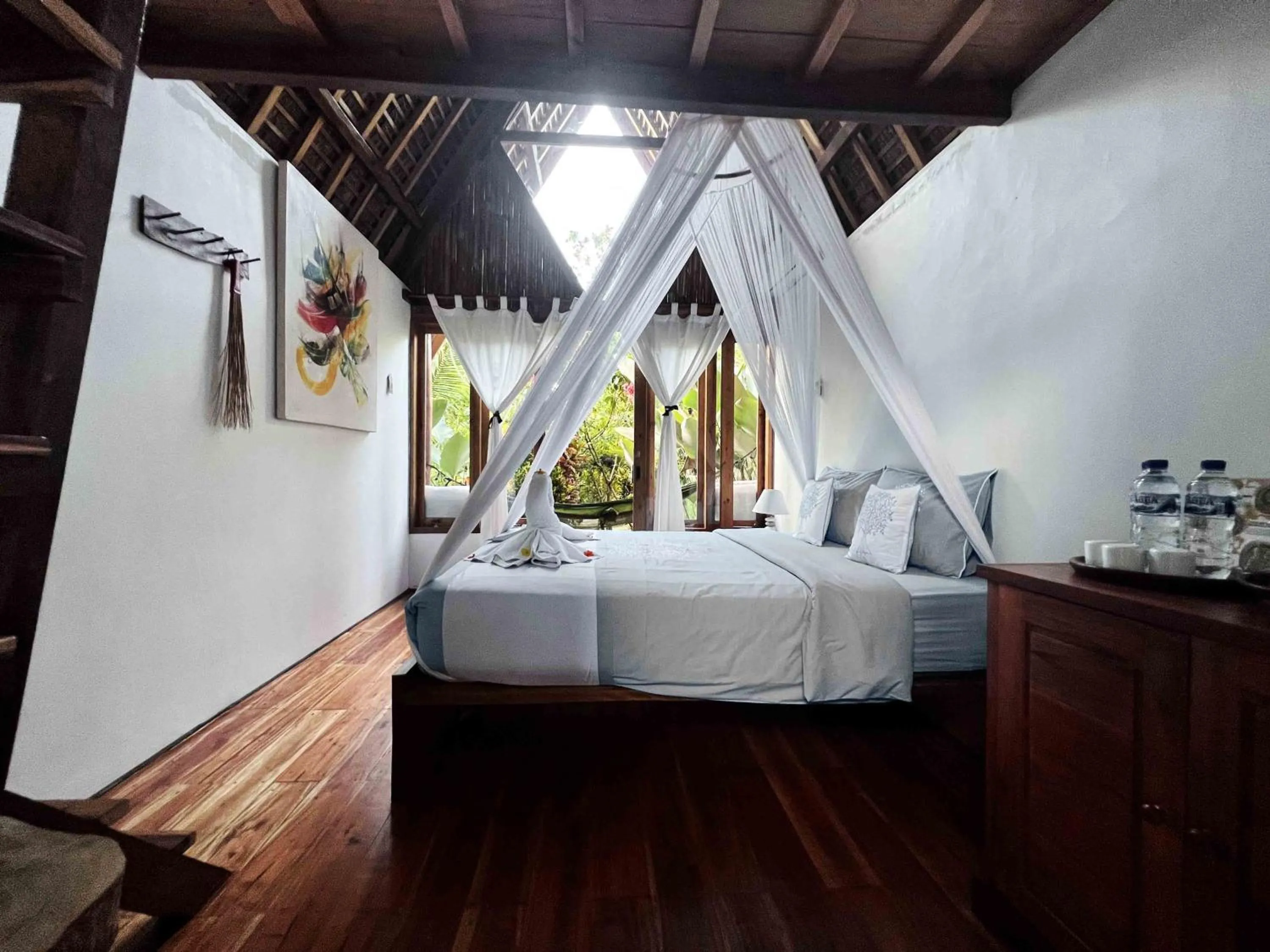 Photo of the whole room, Bed in Lagoona Beach Bungalows - Eco Bungalows Batukaras