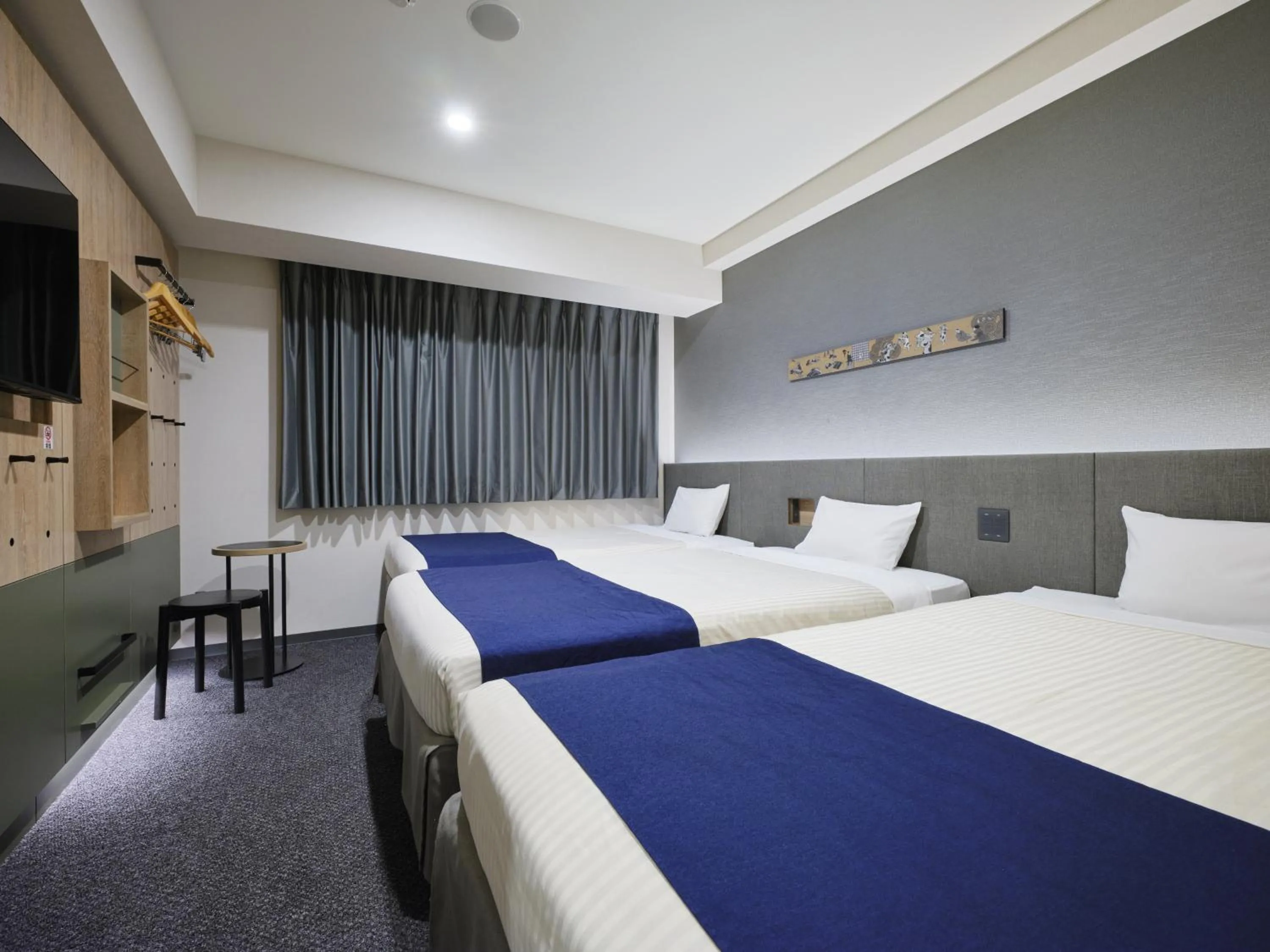 Bed in hotel MONday Premium Ueno Okachimachi