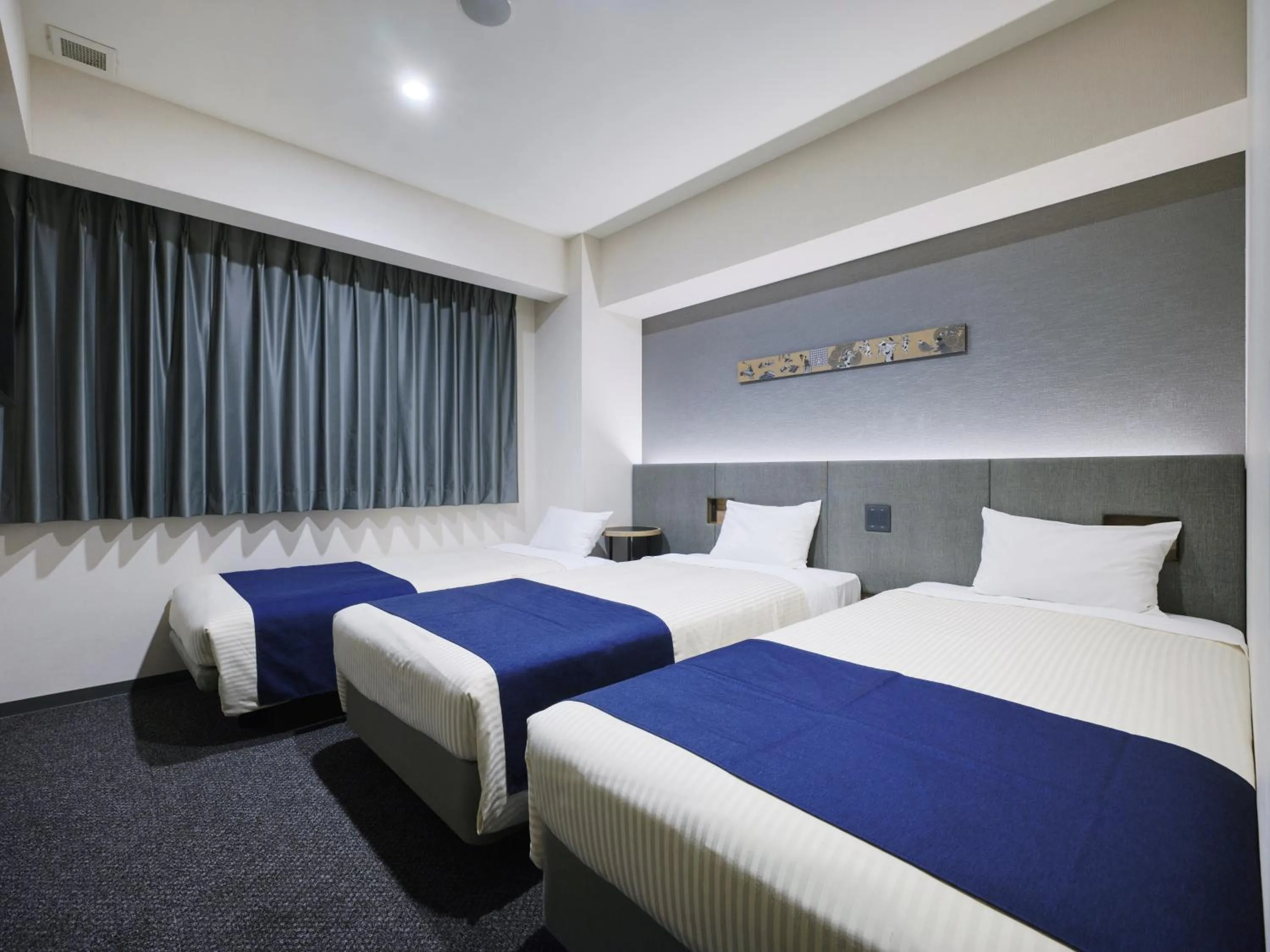 Bed in hotel MONday Premium Ueno Okachimachi