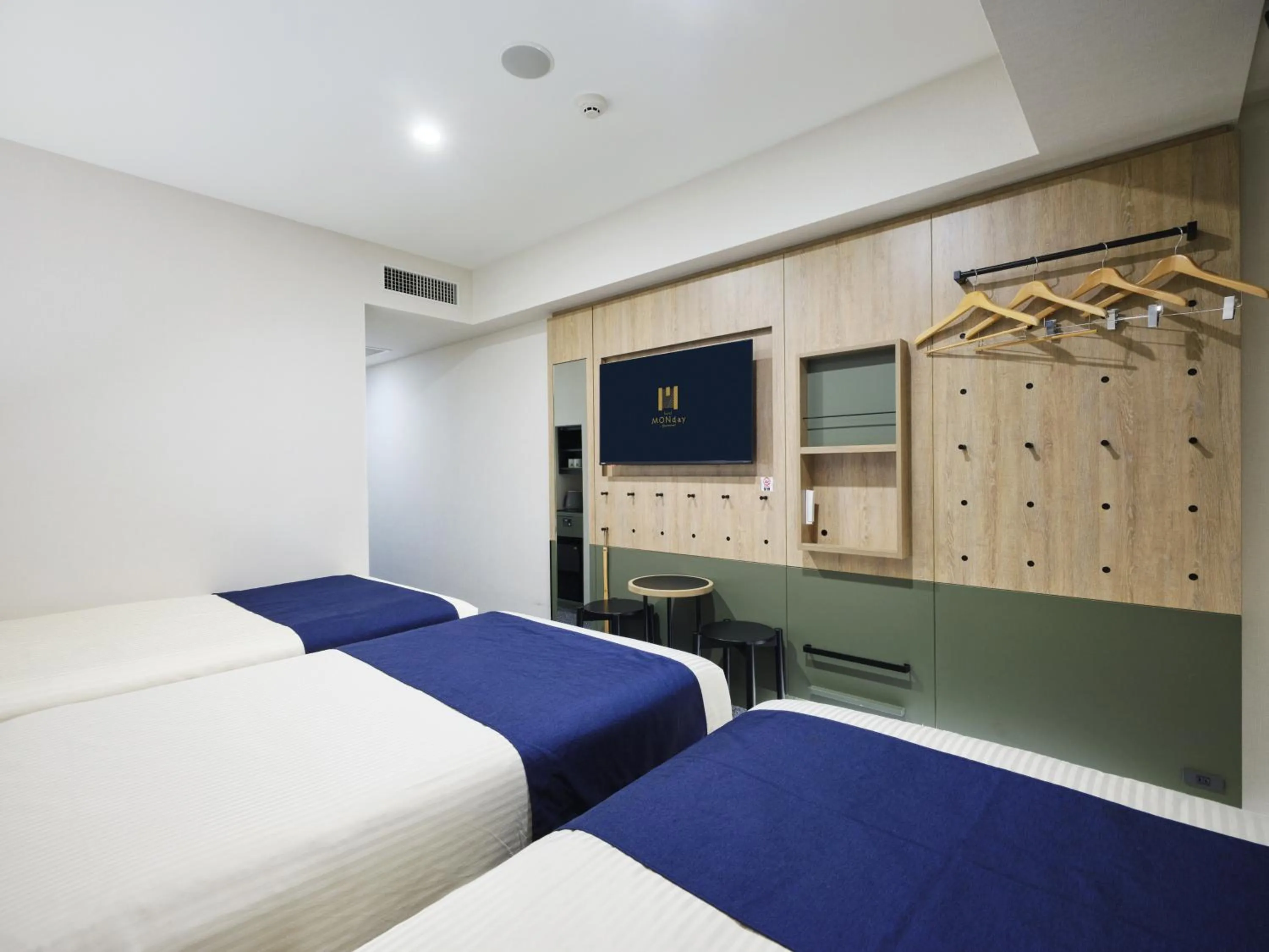 Bed in hotel MONday Premium Ueno Okachimachi