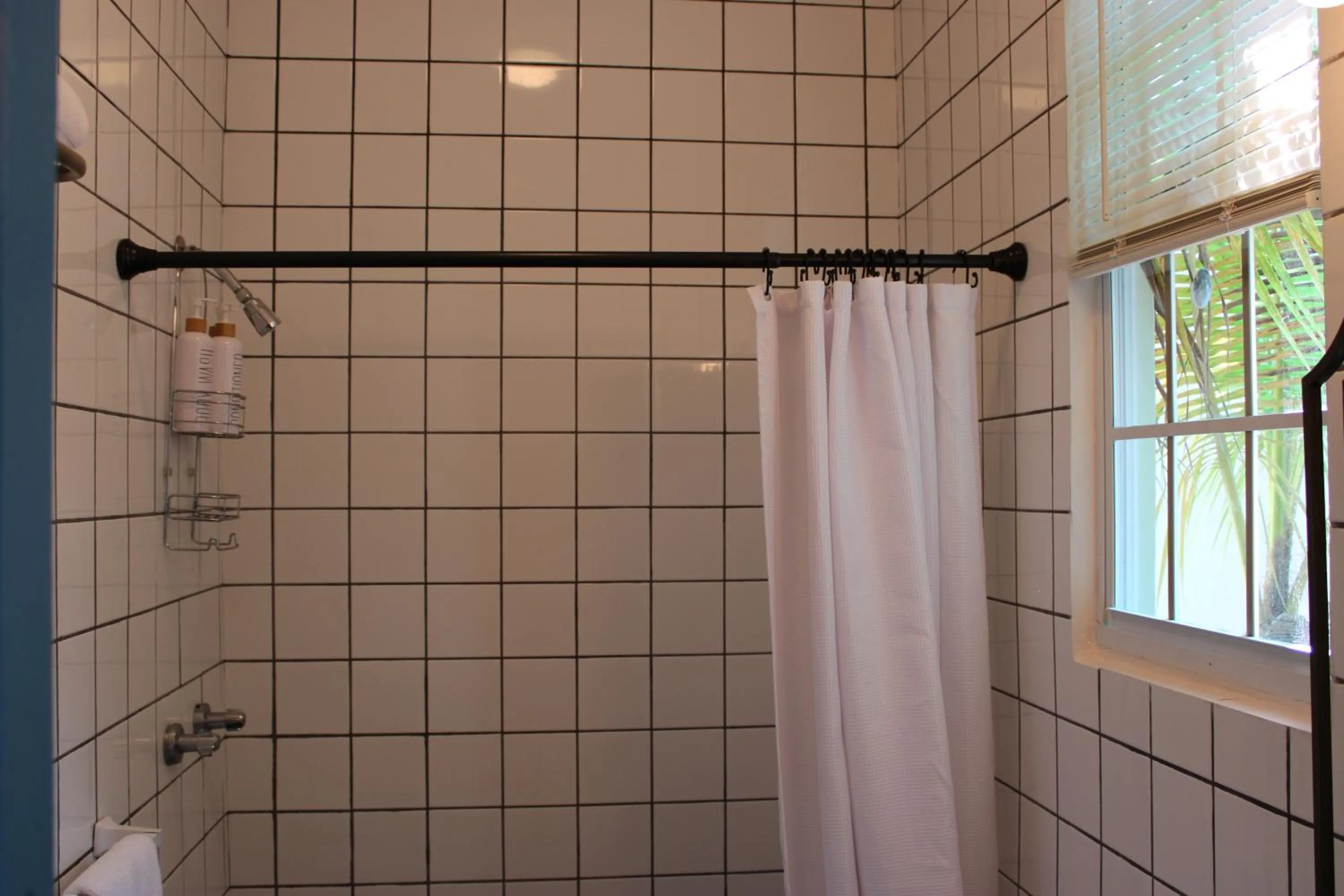 Shower in Numero Uno Beach Apartments