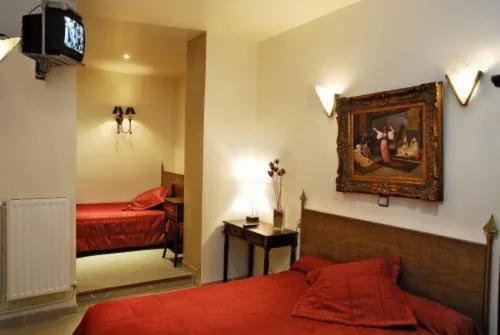 Photo of the whole room, Bed in Hôtel de l'Aveyron