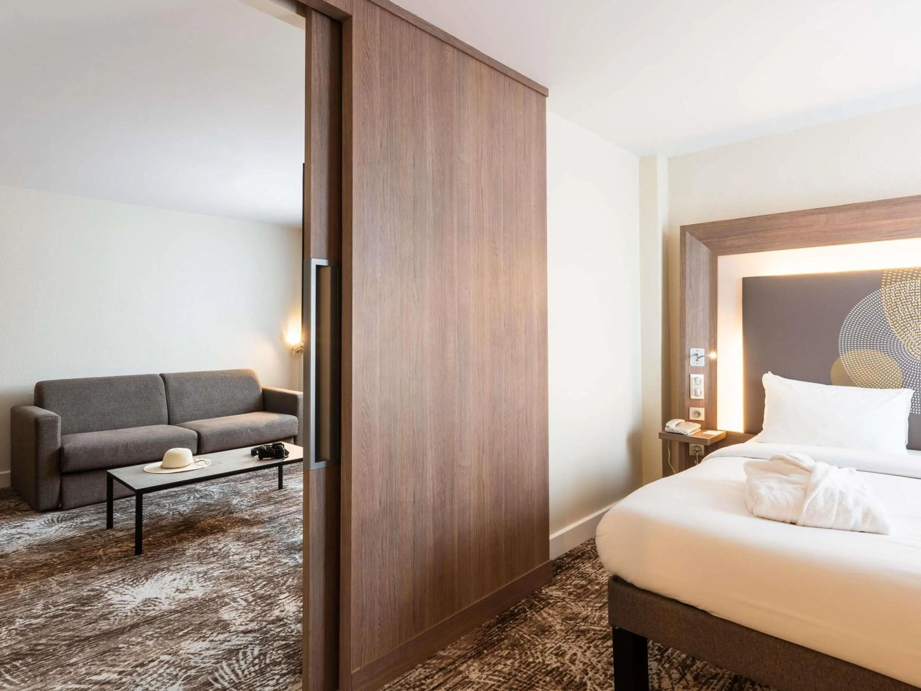 Suite with King Bed and lounge in Novotel Paris Gare De Lyon