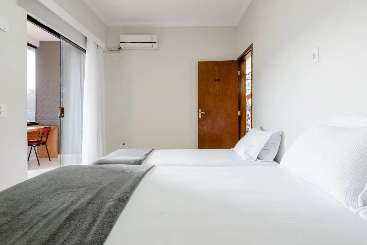 Bed in Pousada Queiroz