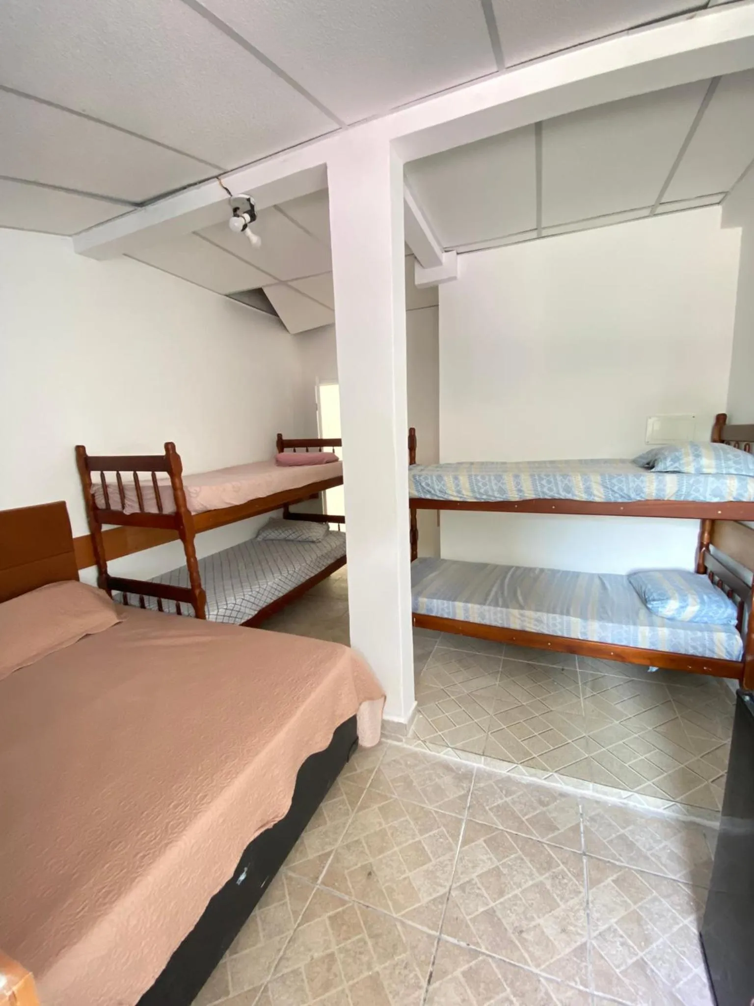 Bed in Pousada Queiroz