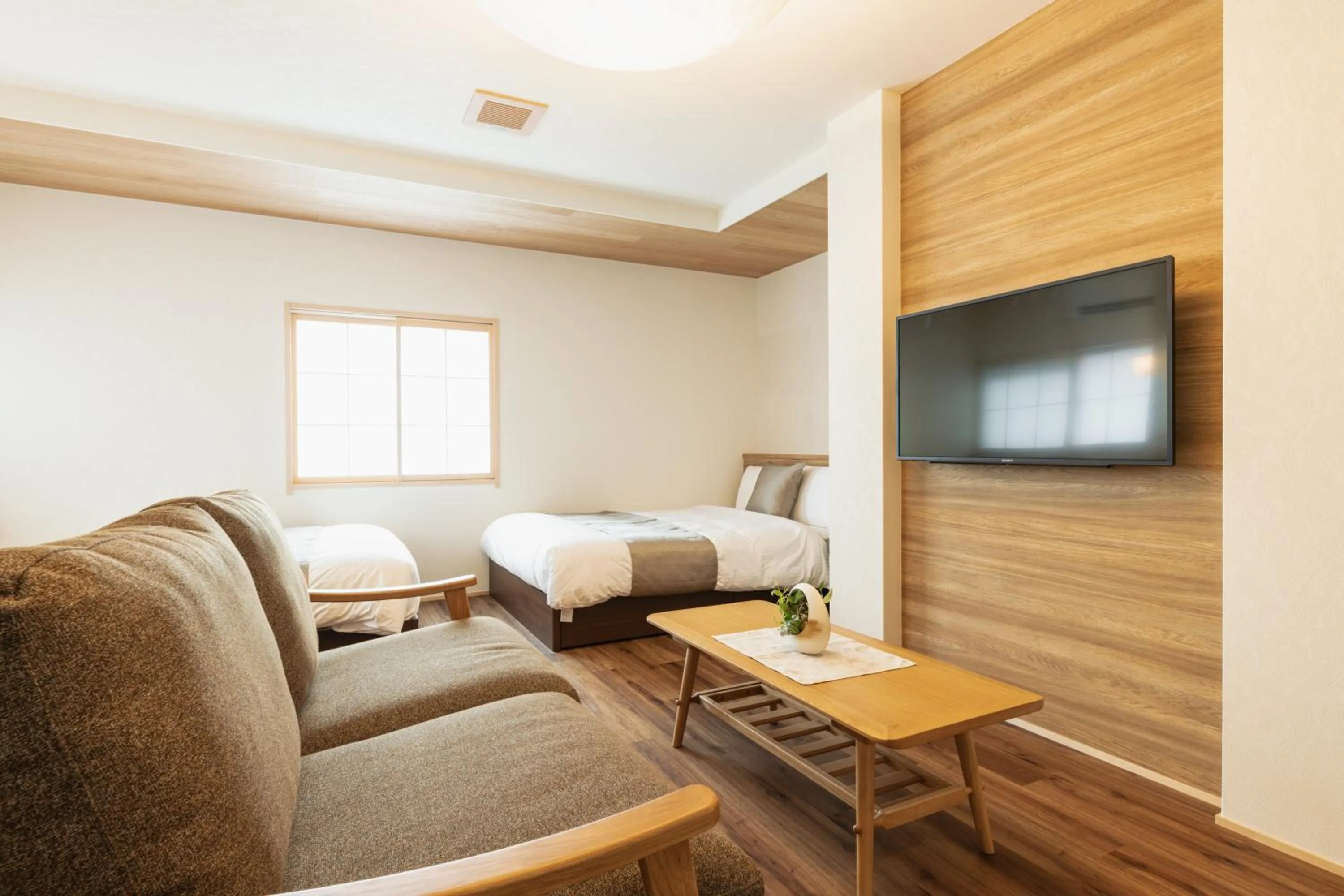 Bed in GRAND BASE Beppu