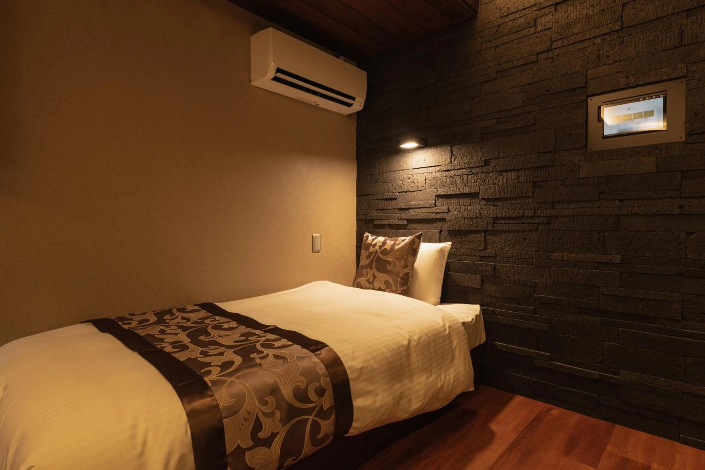 Bed in GRAND BASE Beppu