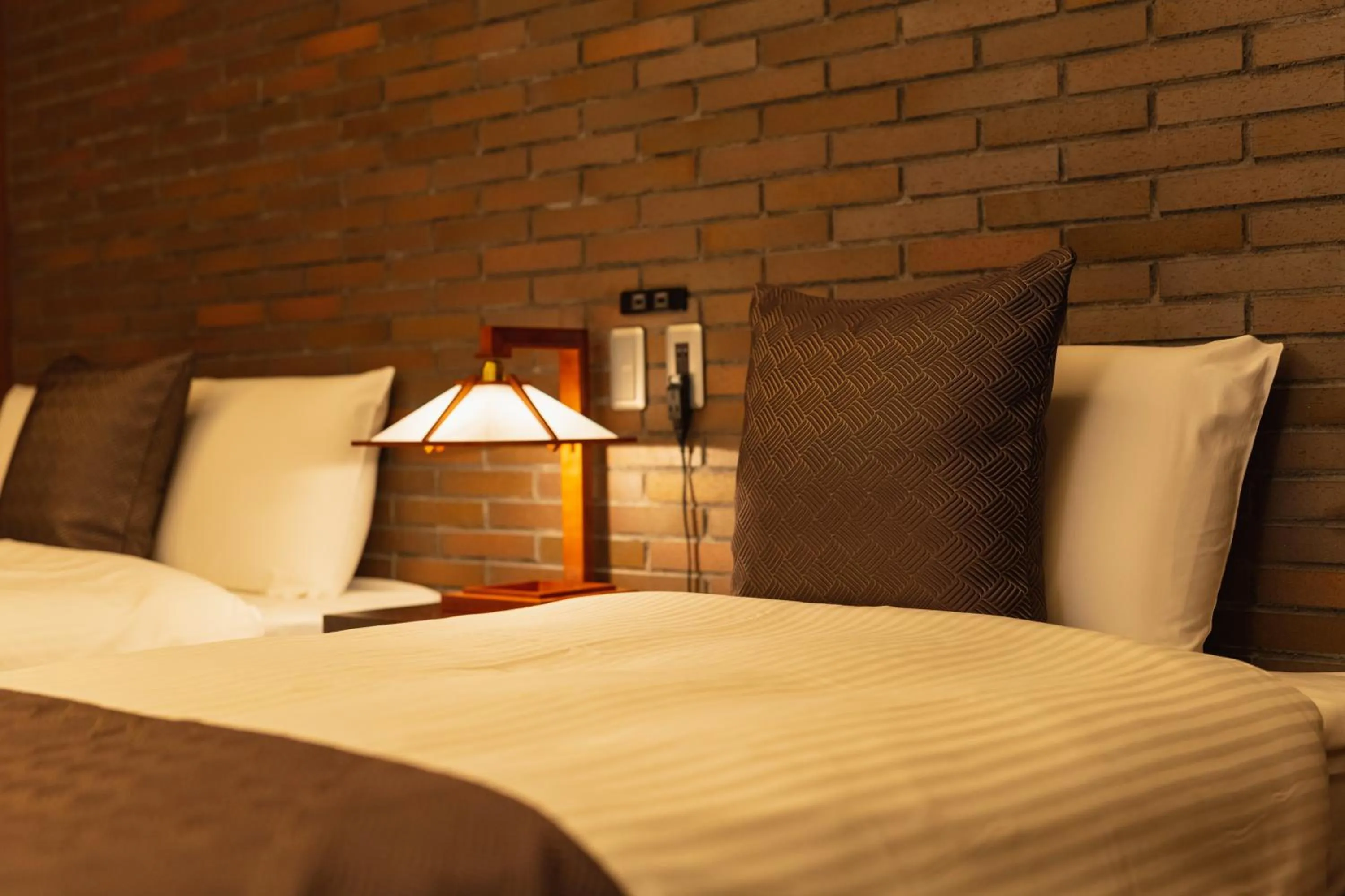 Bed in GRAND BASE Beppu