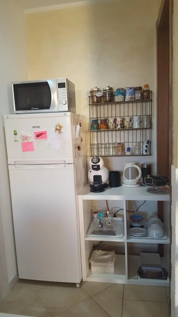 Coffee/tea facilities in B&B Villa Orchidea