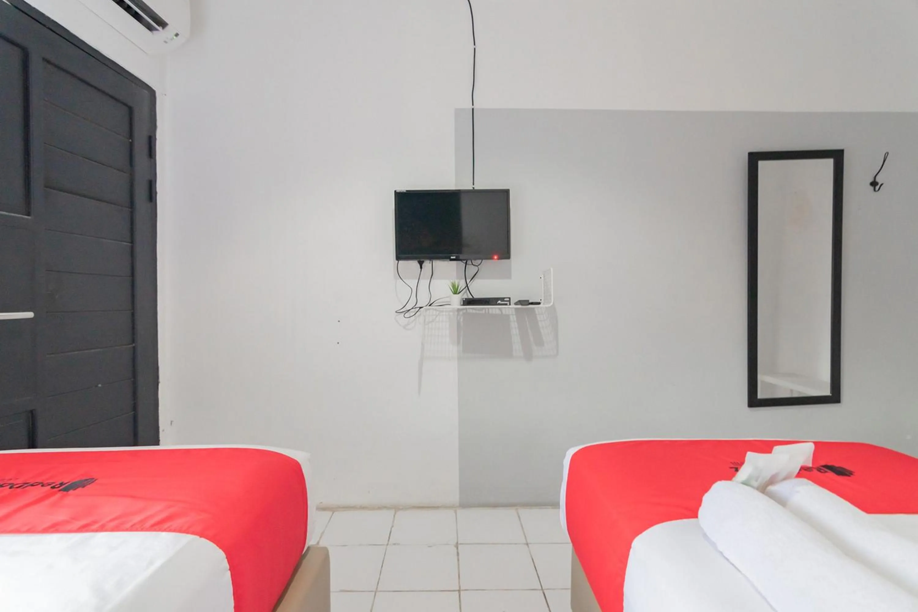 Bed in RedDoorz At Sani Guest House Balikpapan