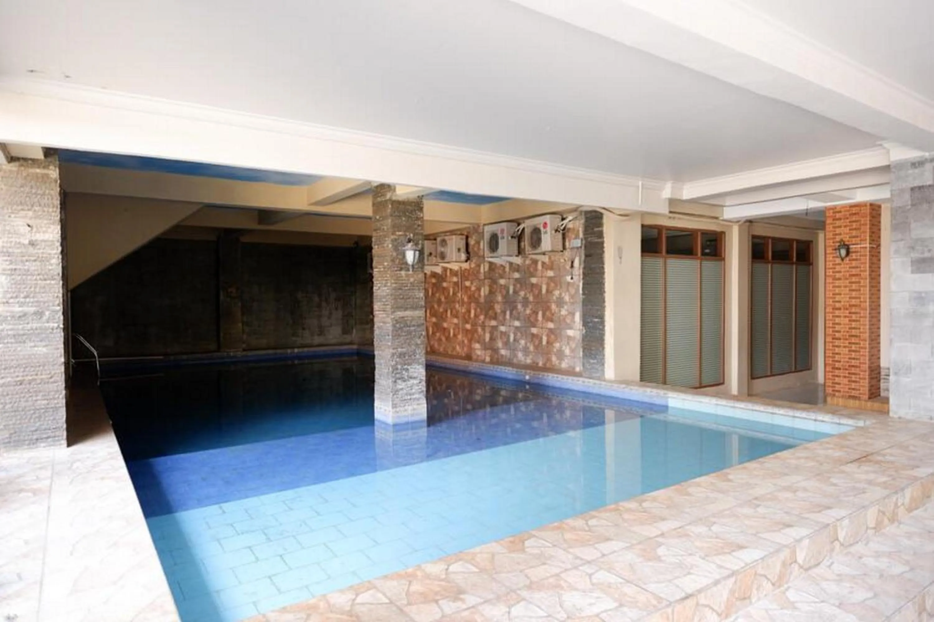 Swimming pool in RedDoorz Plus at Hotel Srikandi Kendari