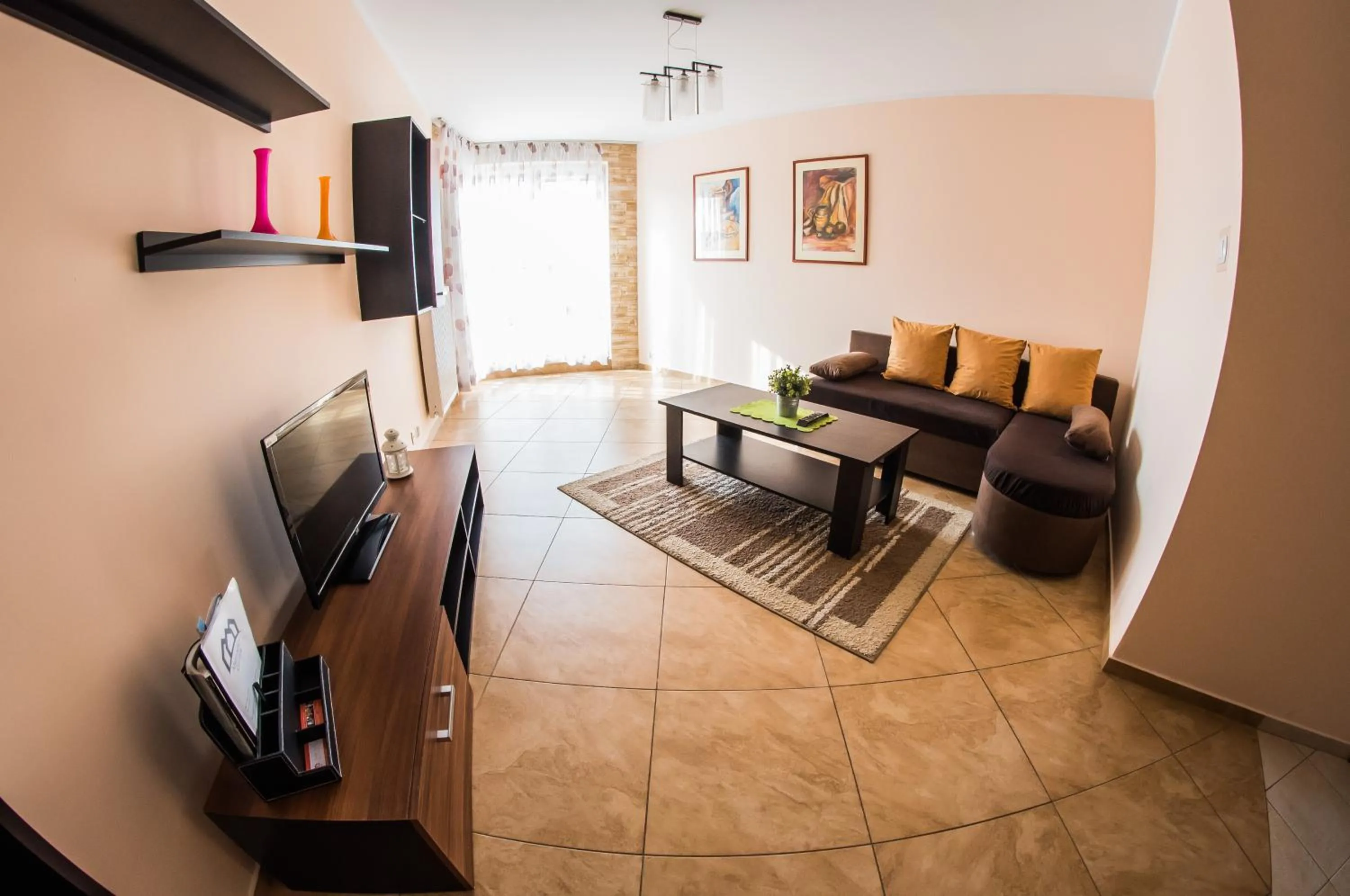 Communal lounge/ TV room in Apartamenty Centrum