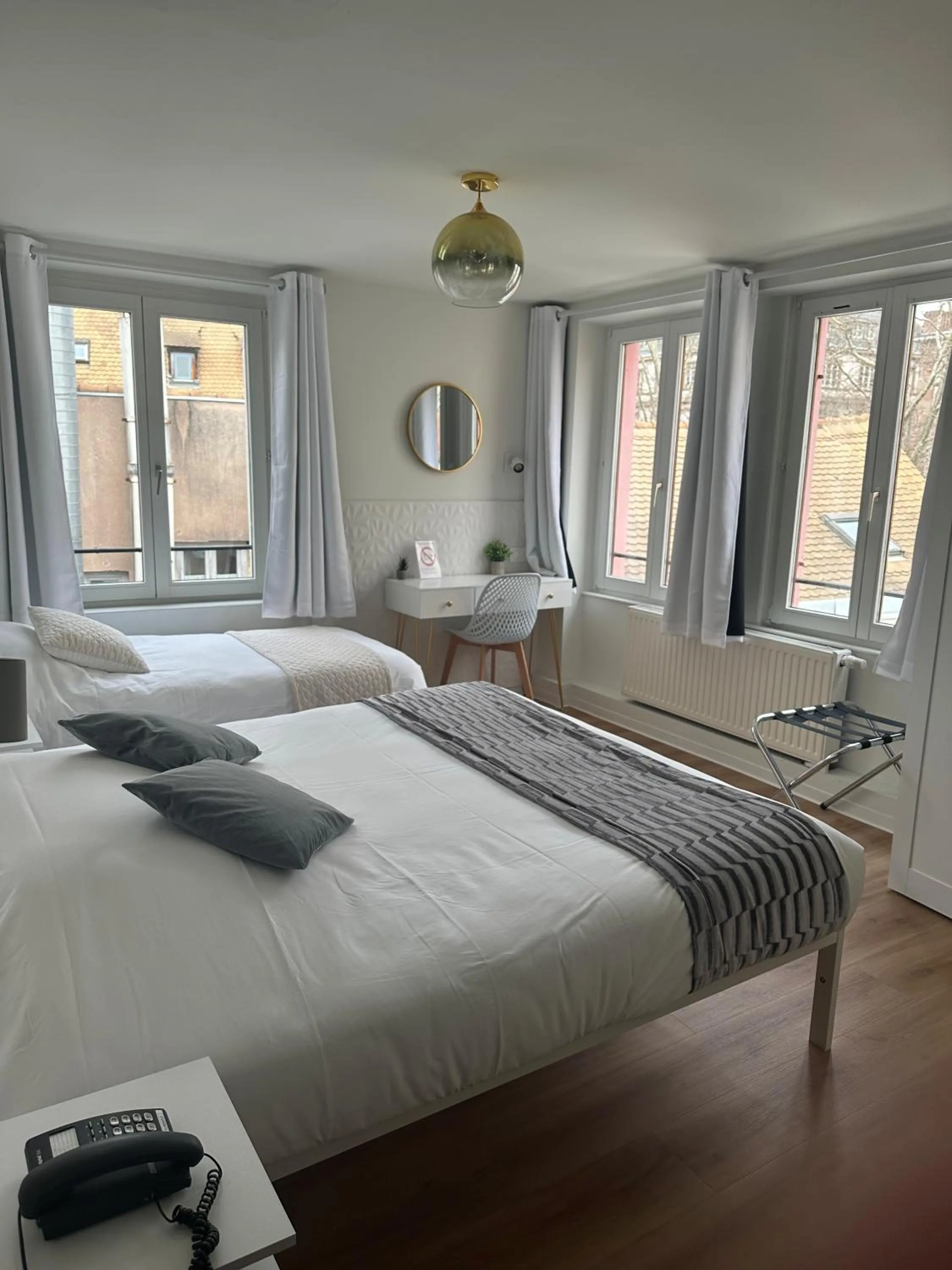 Photo of the whole room, Bed in EtC...Hôtel - Strasbourg Hyper Centre