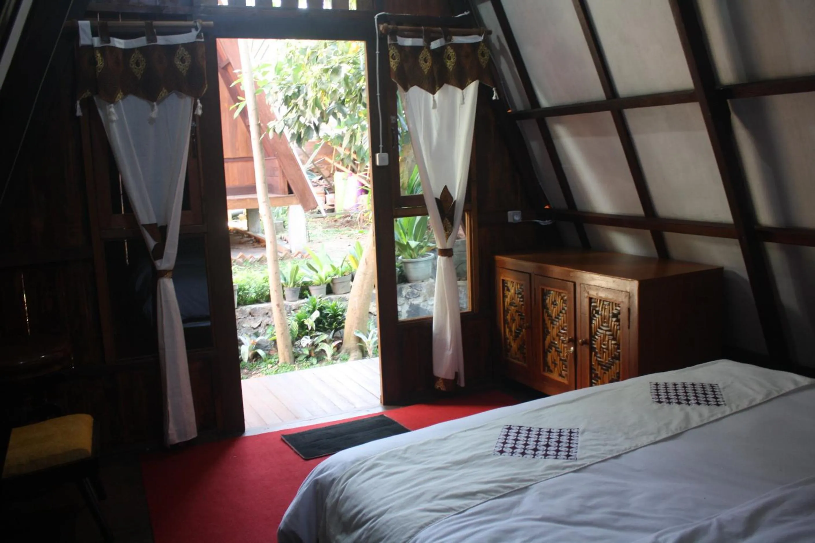 Bed in Bliss family cottage Batu