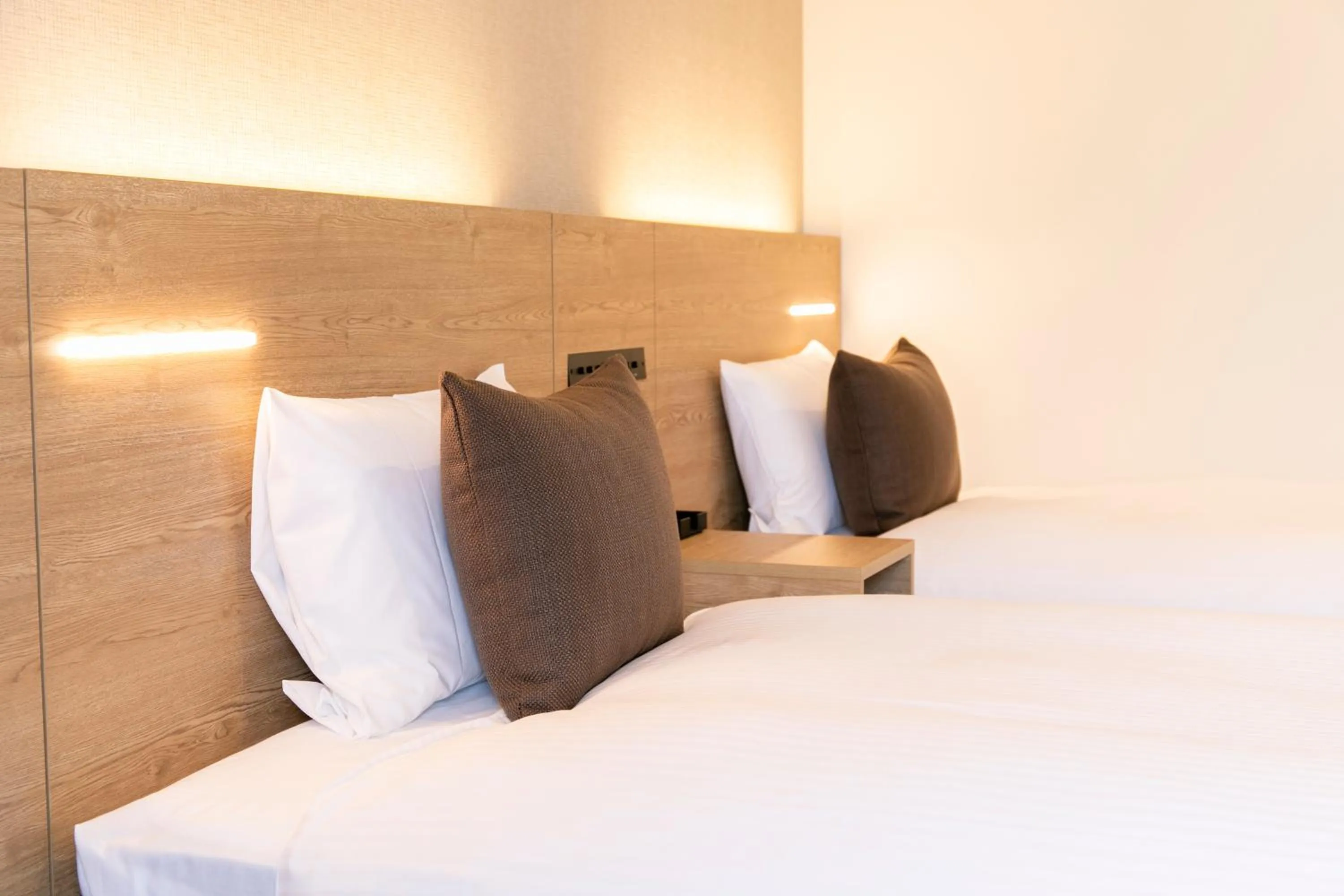 Photo of the whole room, Bed in KOKO HOTEL Sapporo Susukino - formerly Hotel Wing International Sapporo Susukino