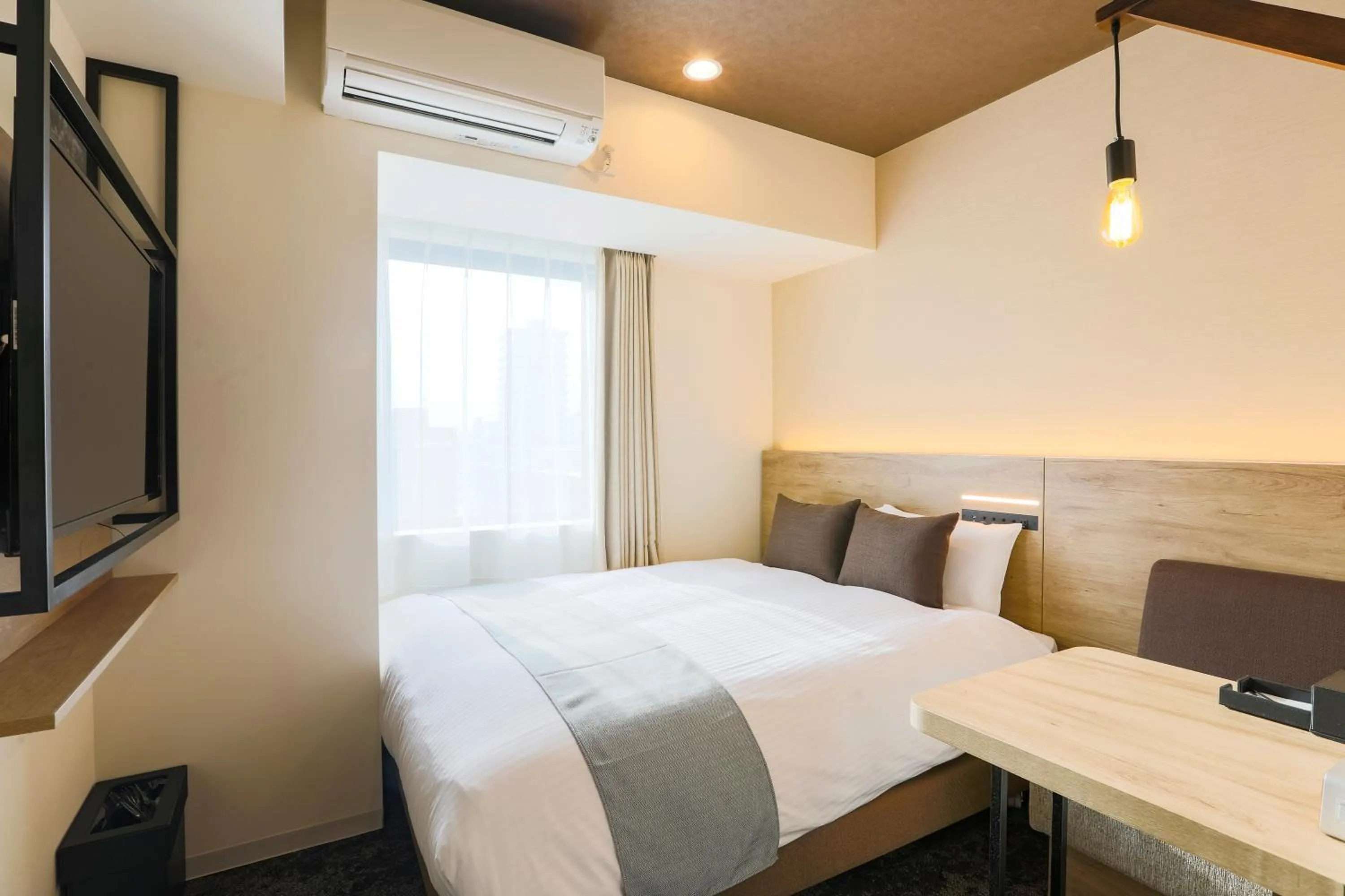 Photo of the whole room, Bed in KOKO HOTEL Sapporo Susukino - formerly Hotel Wing International Sapporo Susukino