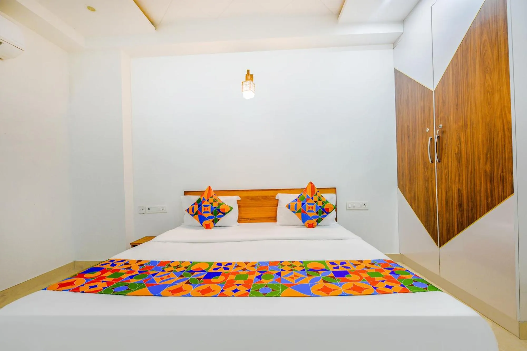 Bed in FabHotel Amrit Residency
