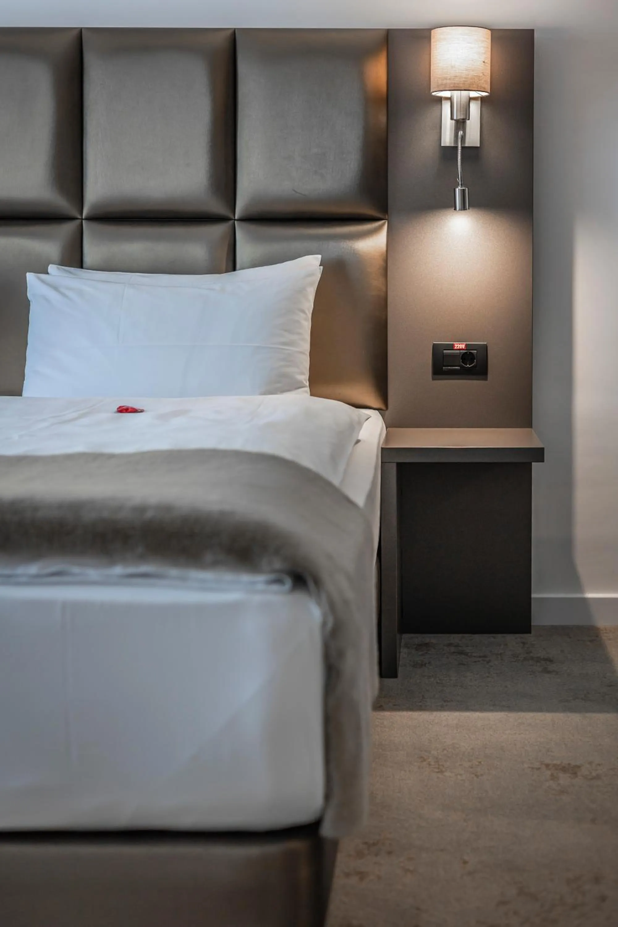 Bed in Charm Boutique Hotel